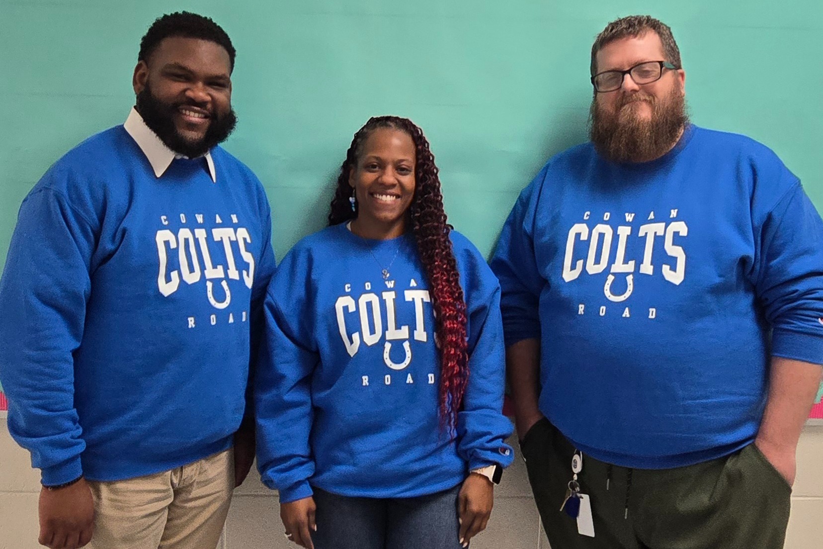 teachers in blue Cowan Colts shirts