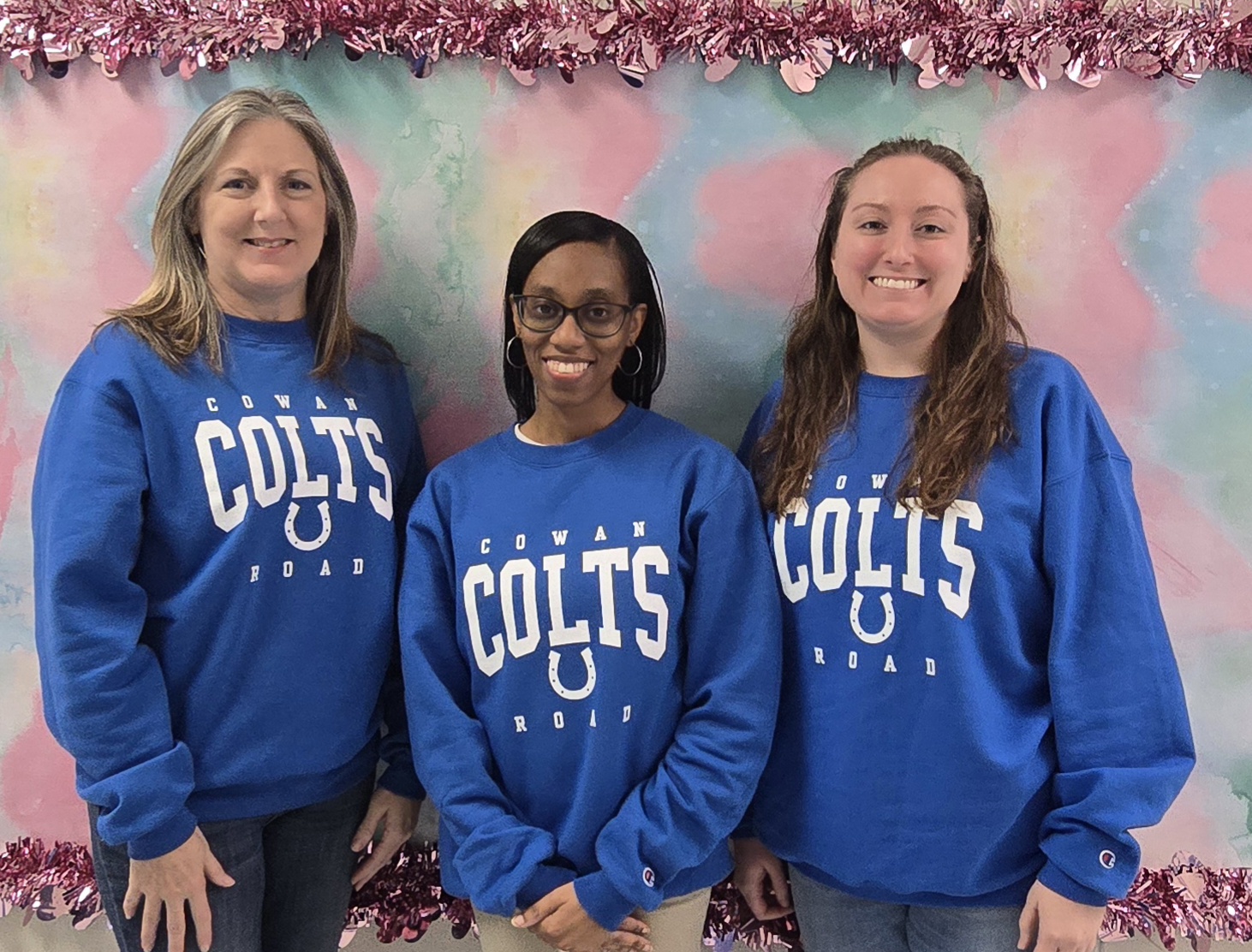 teachers in blue Cowan Colts shirts