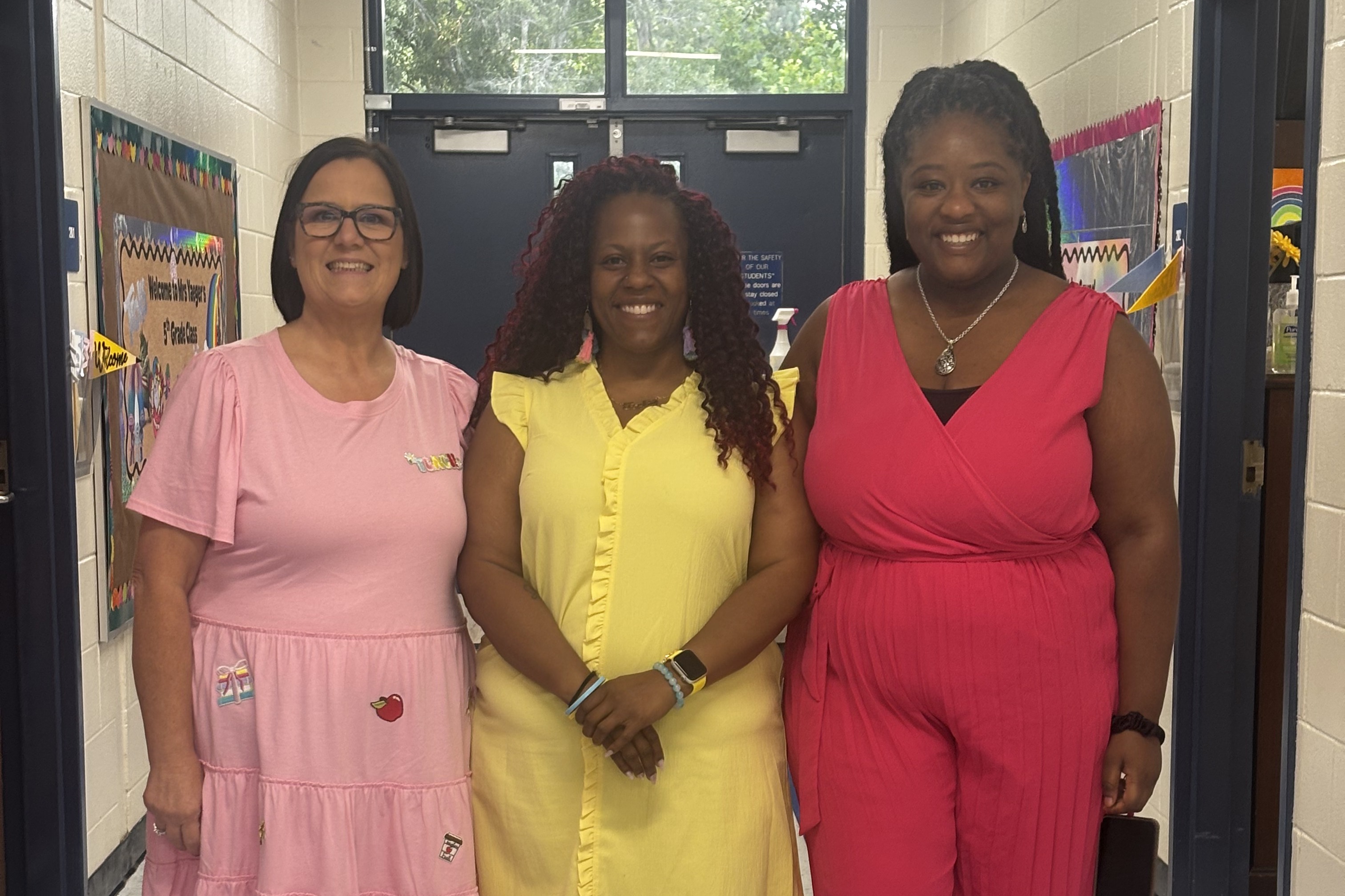 3 women standing in hall