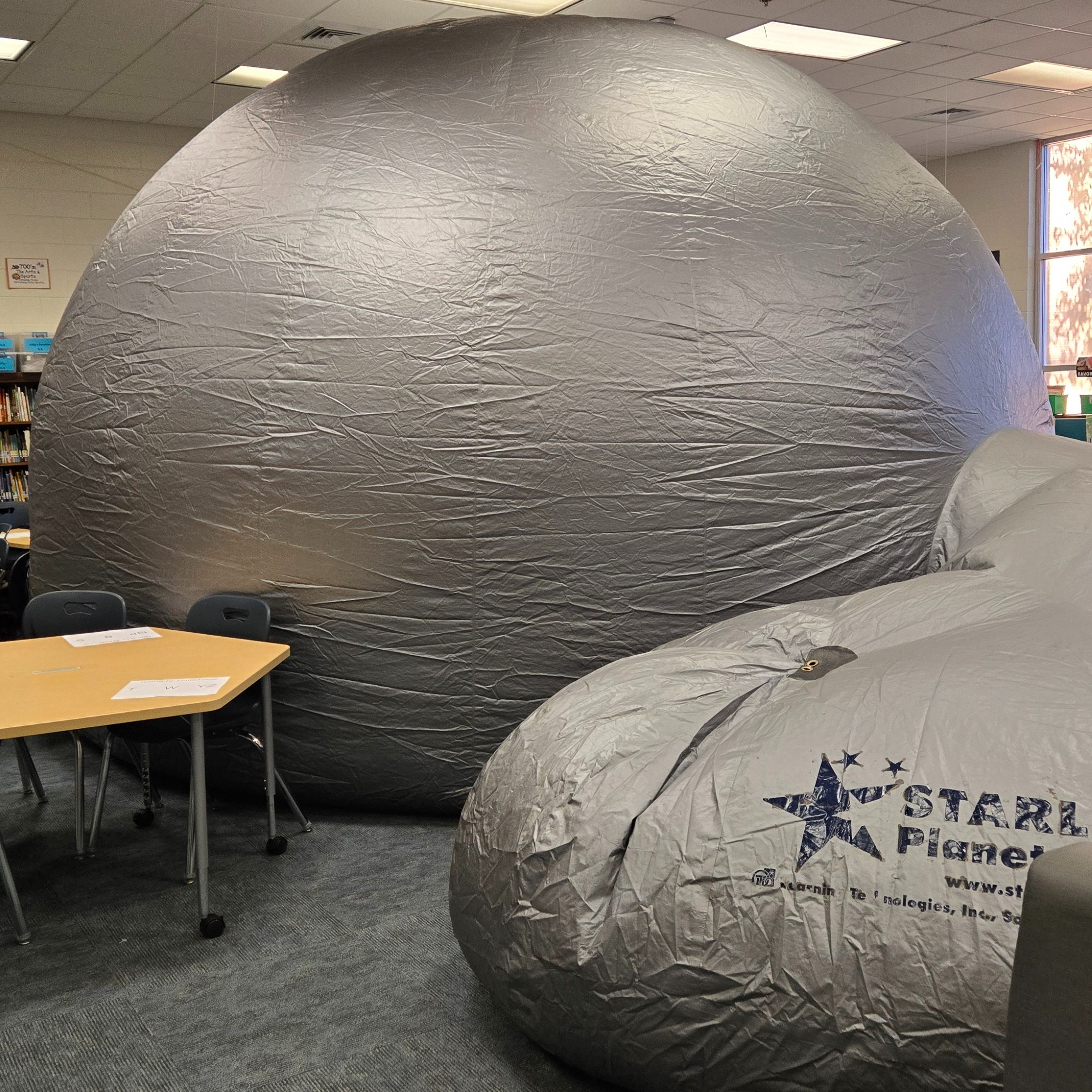 inflatable star lab is shown in the media center