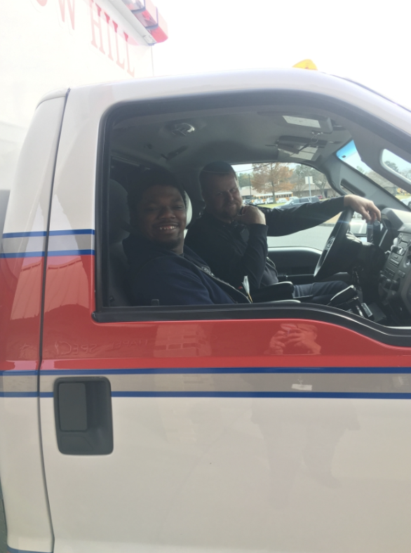 student in a work truck