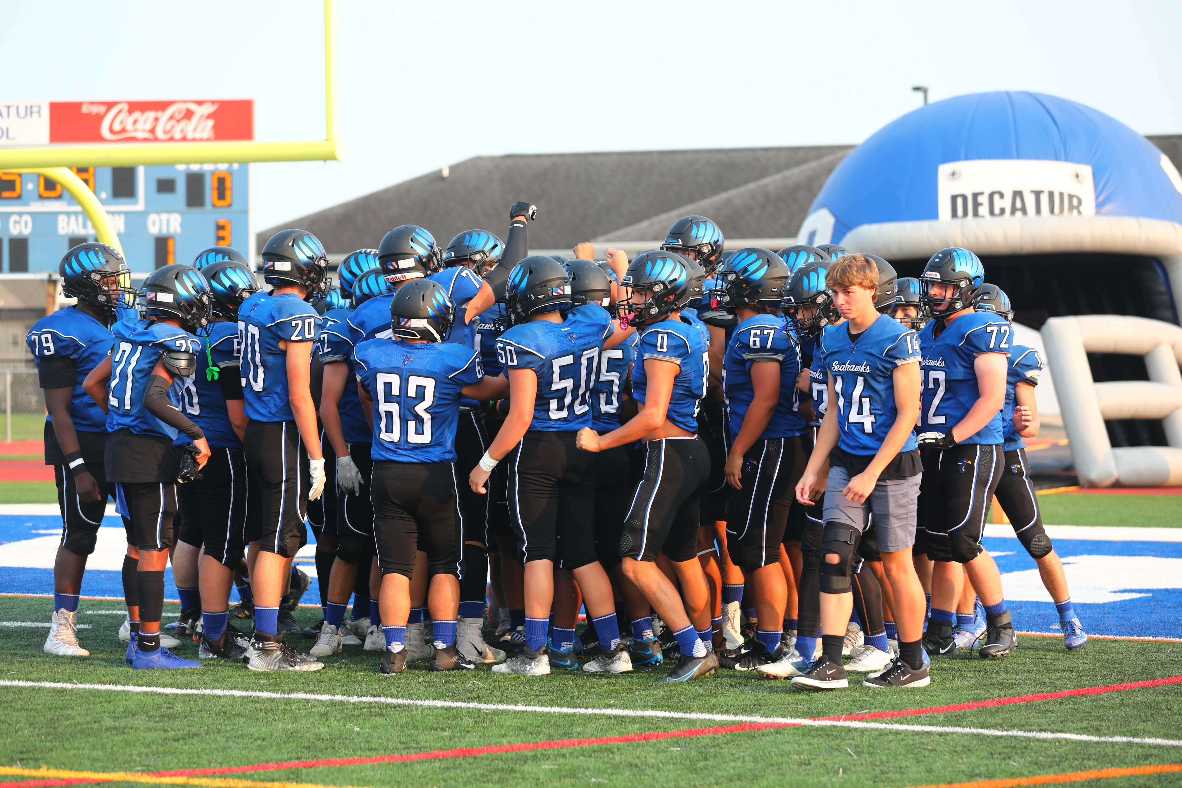 team huddle on field