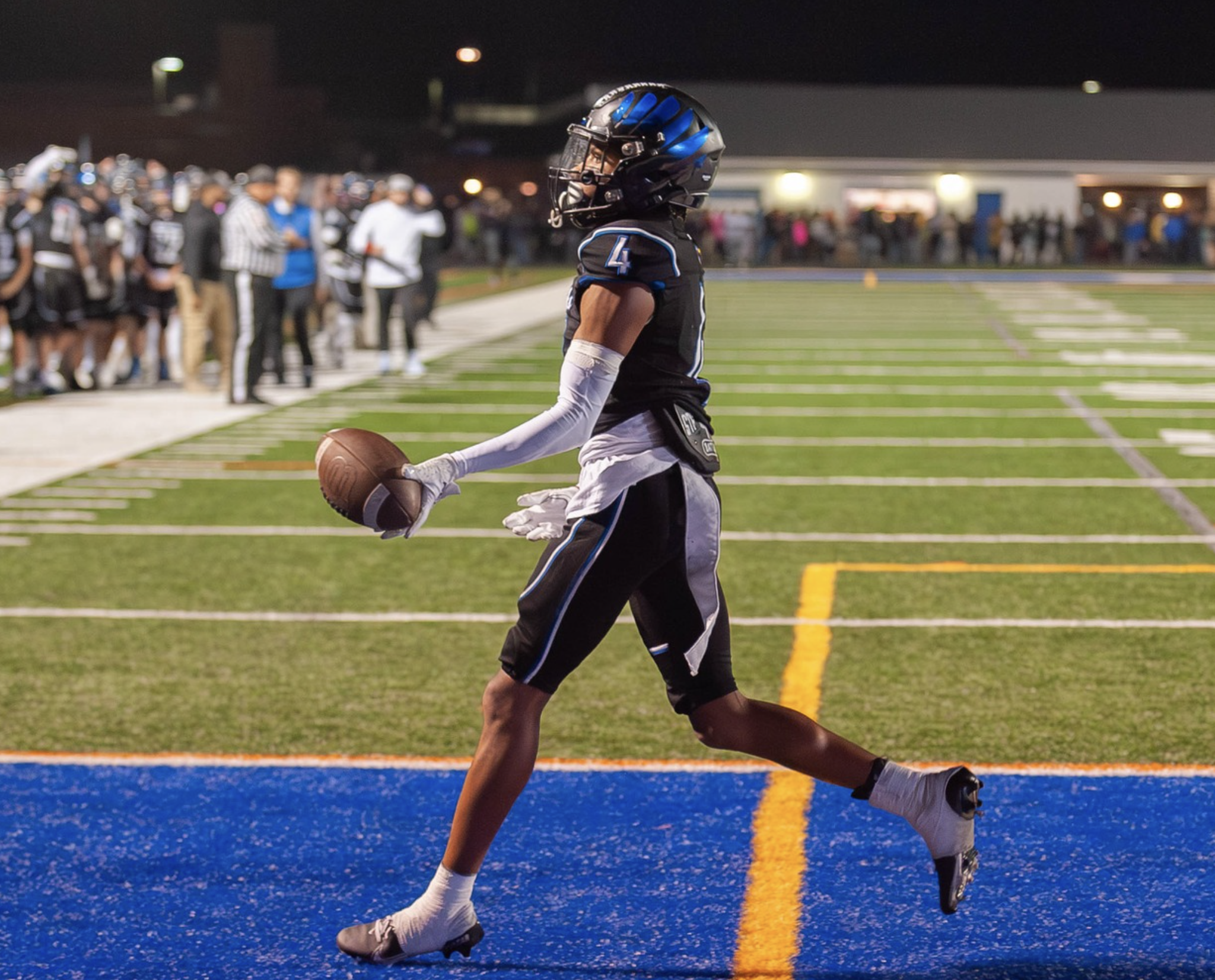 SDHS kicking football