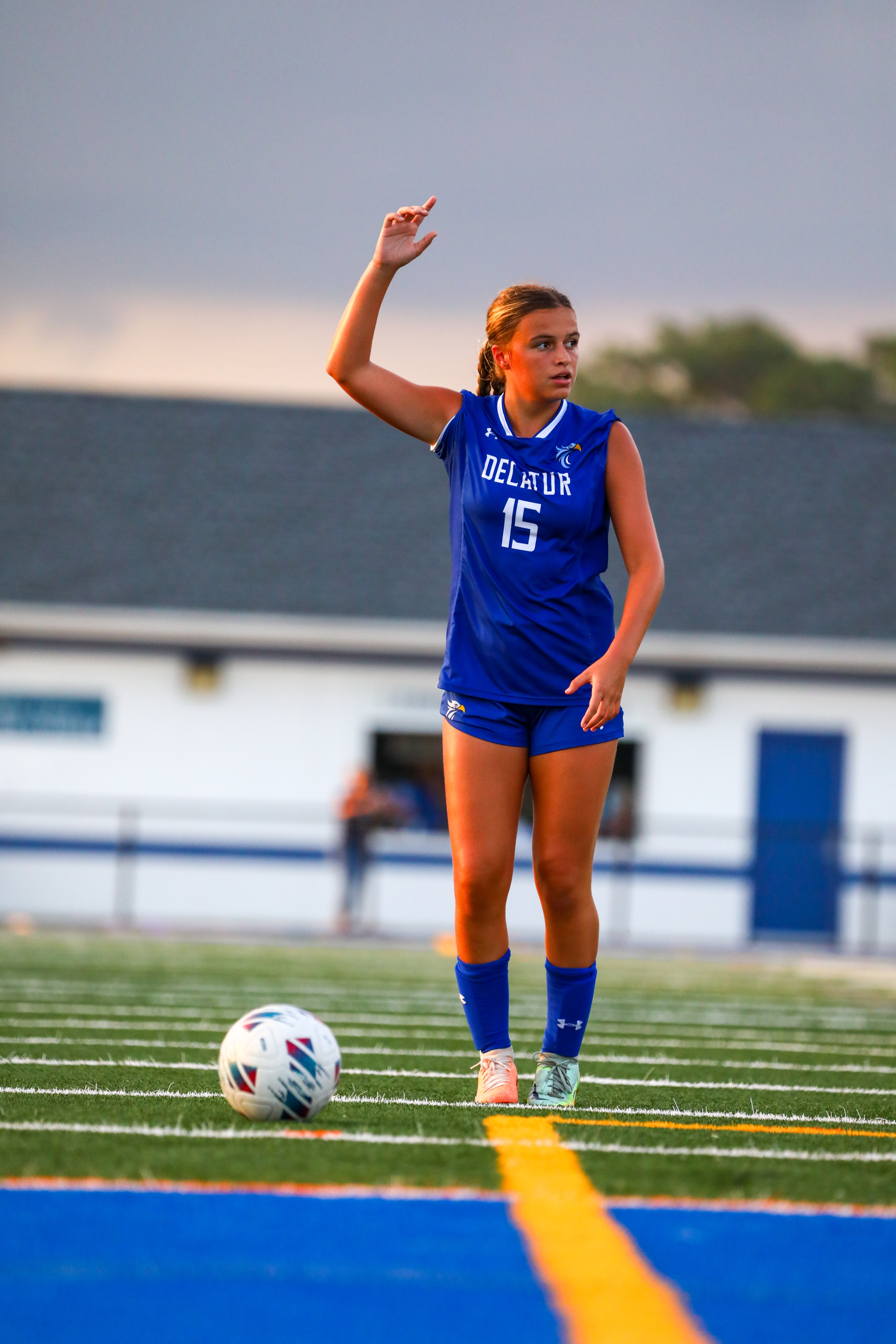 Varsity girl on field