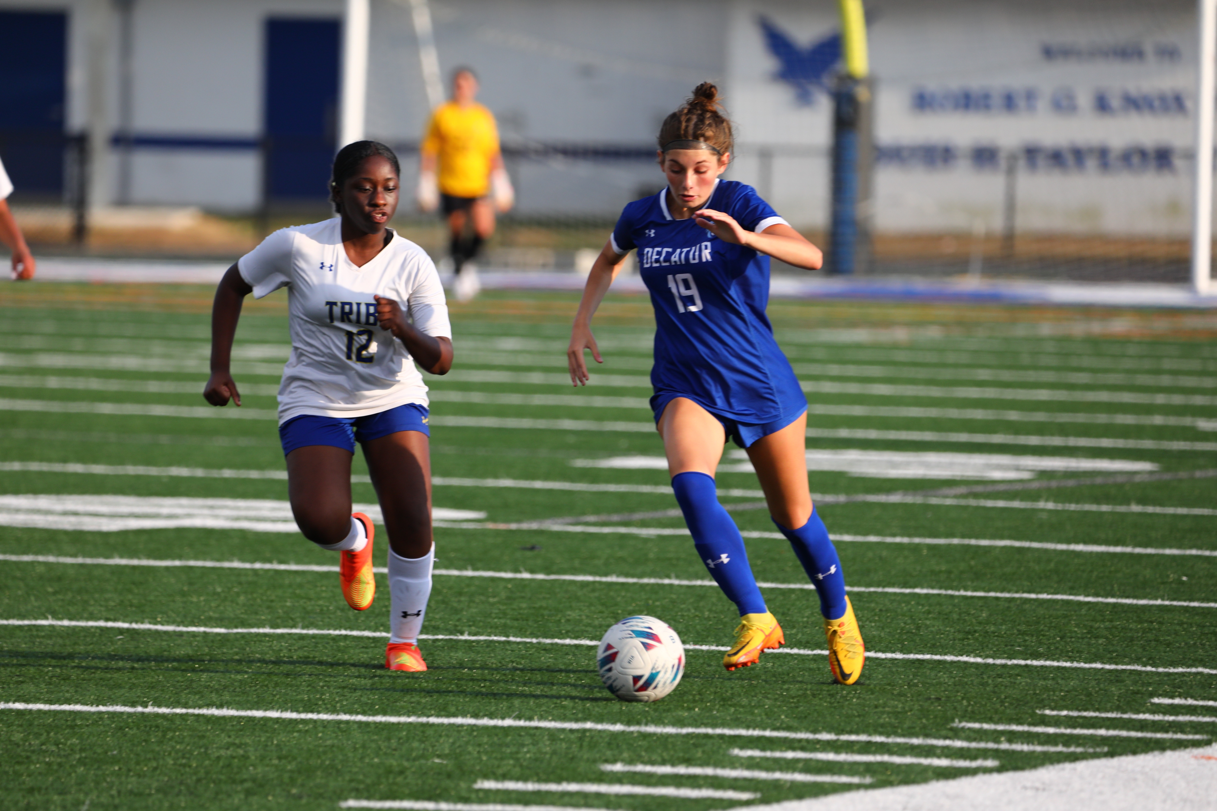 Varsity girl on field