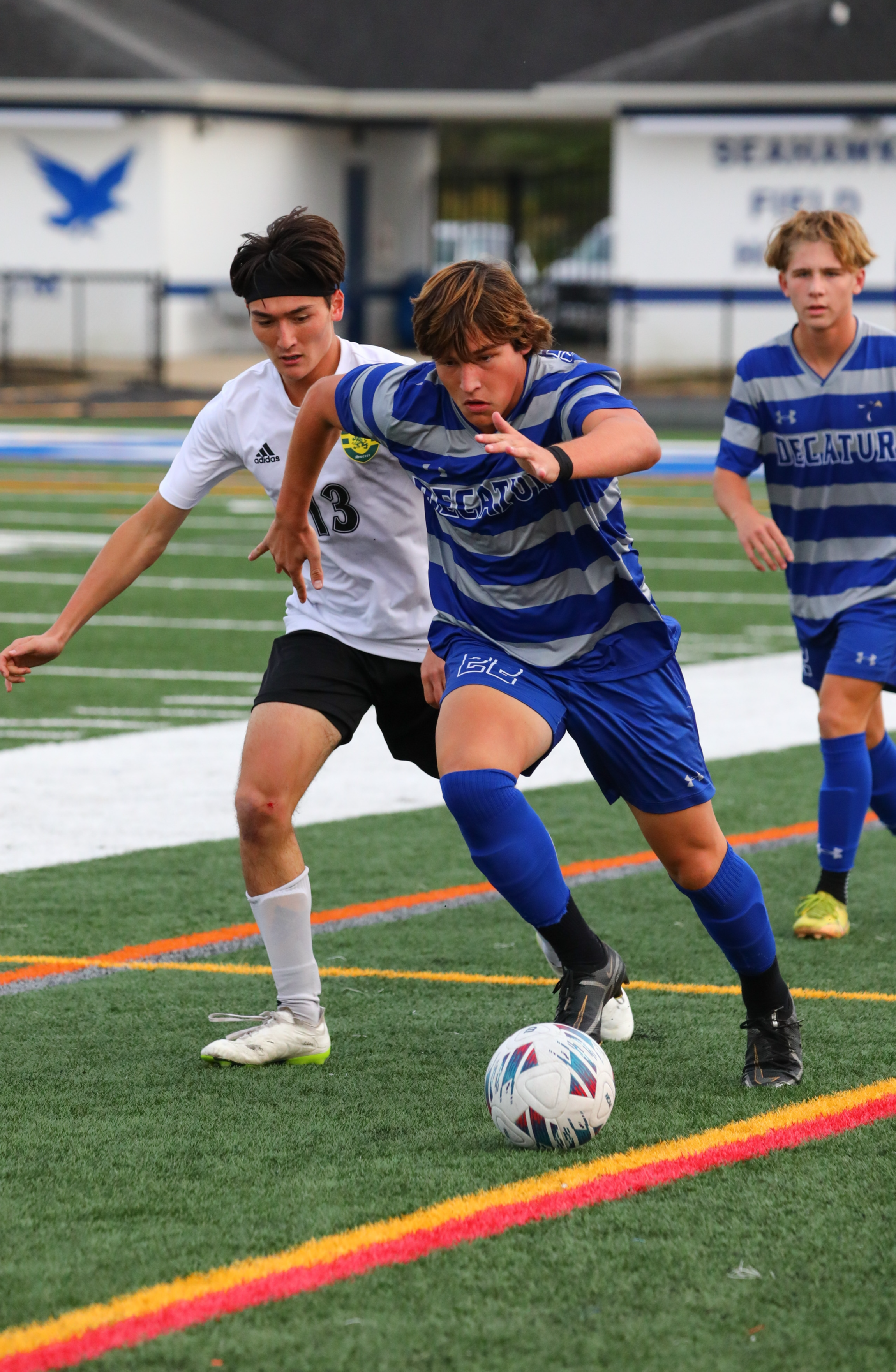 Varsity boy on field