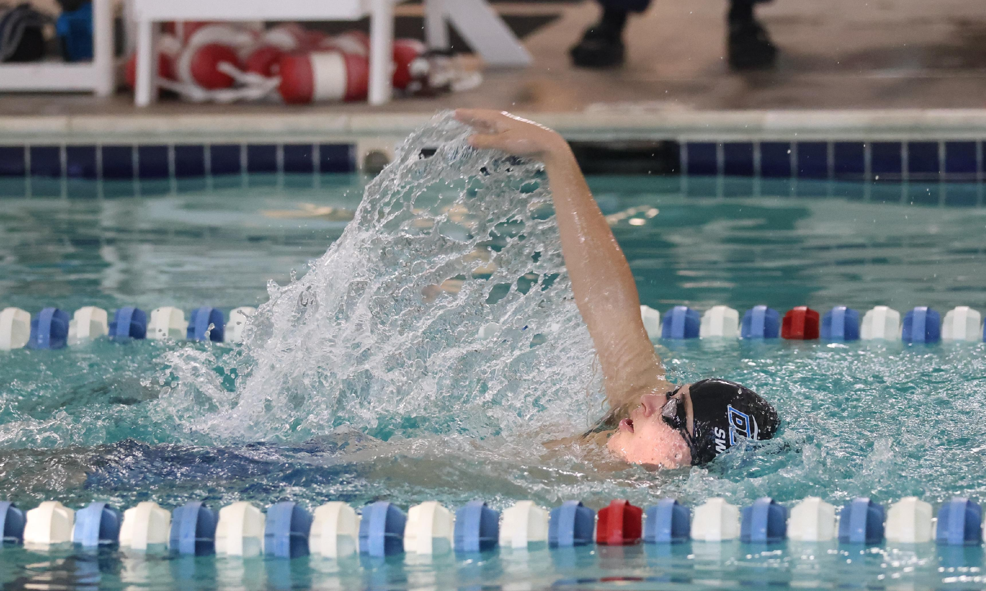 boy backstroking