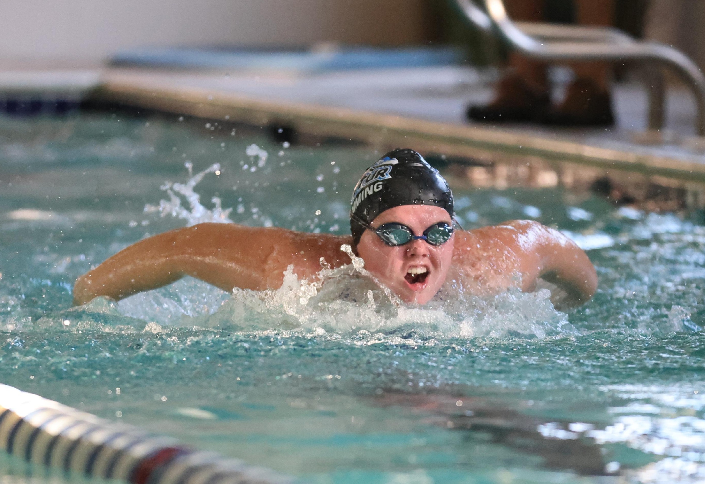 girl doing butterfly stroke