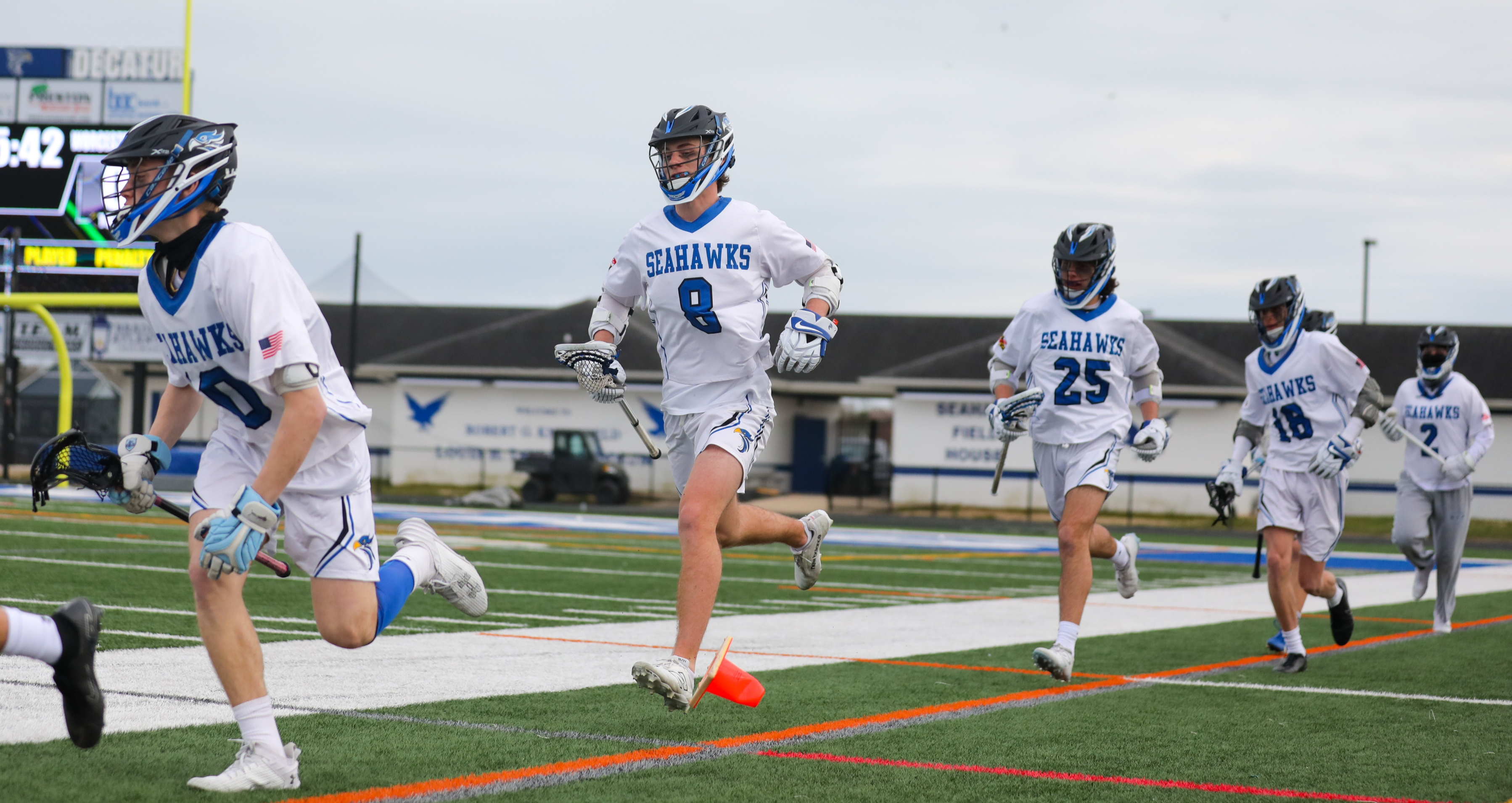 LAX team running on field