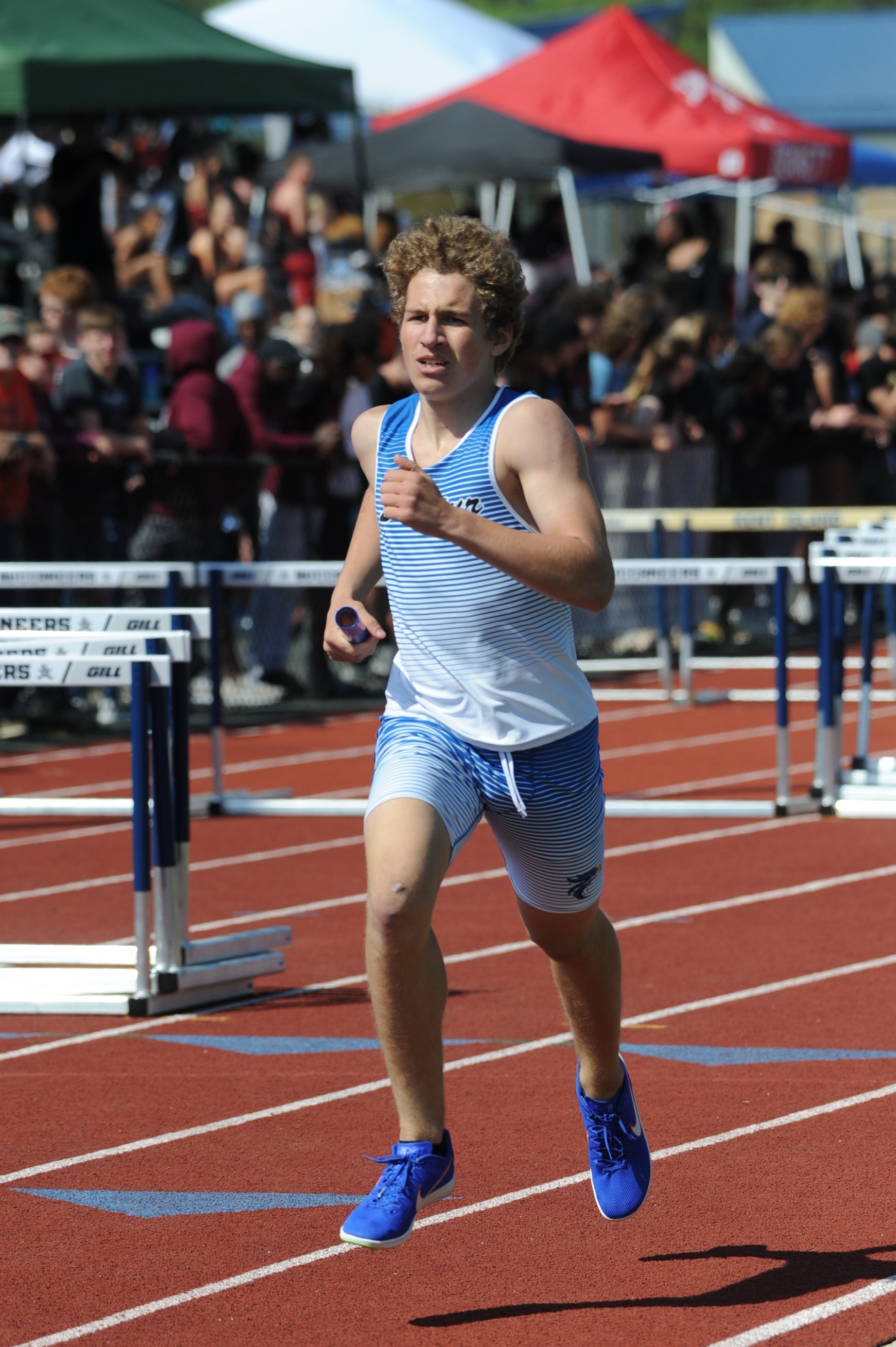 boy runner with baton