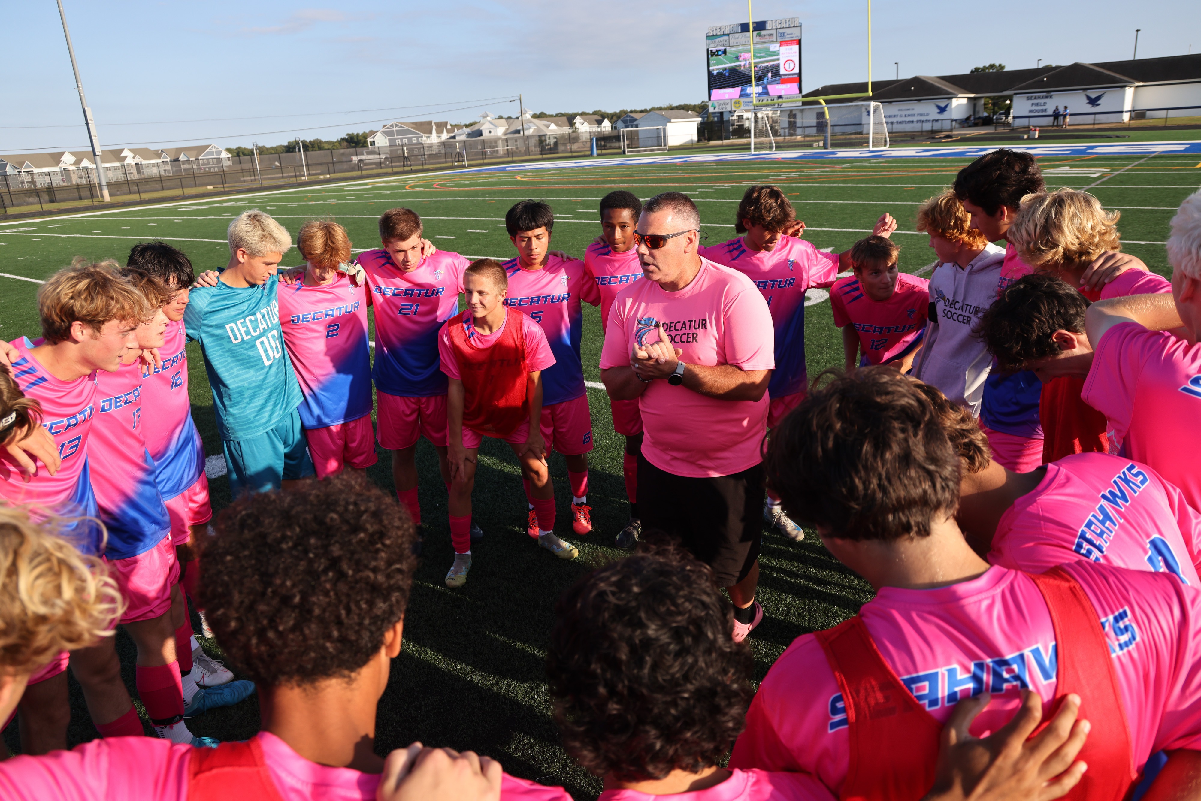 Mens Varsity soccer team and coach