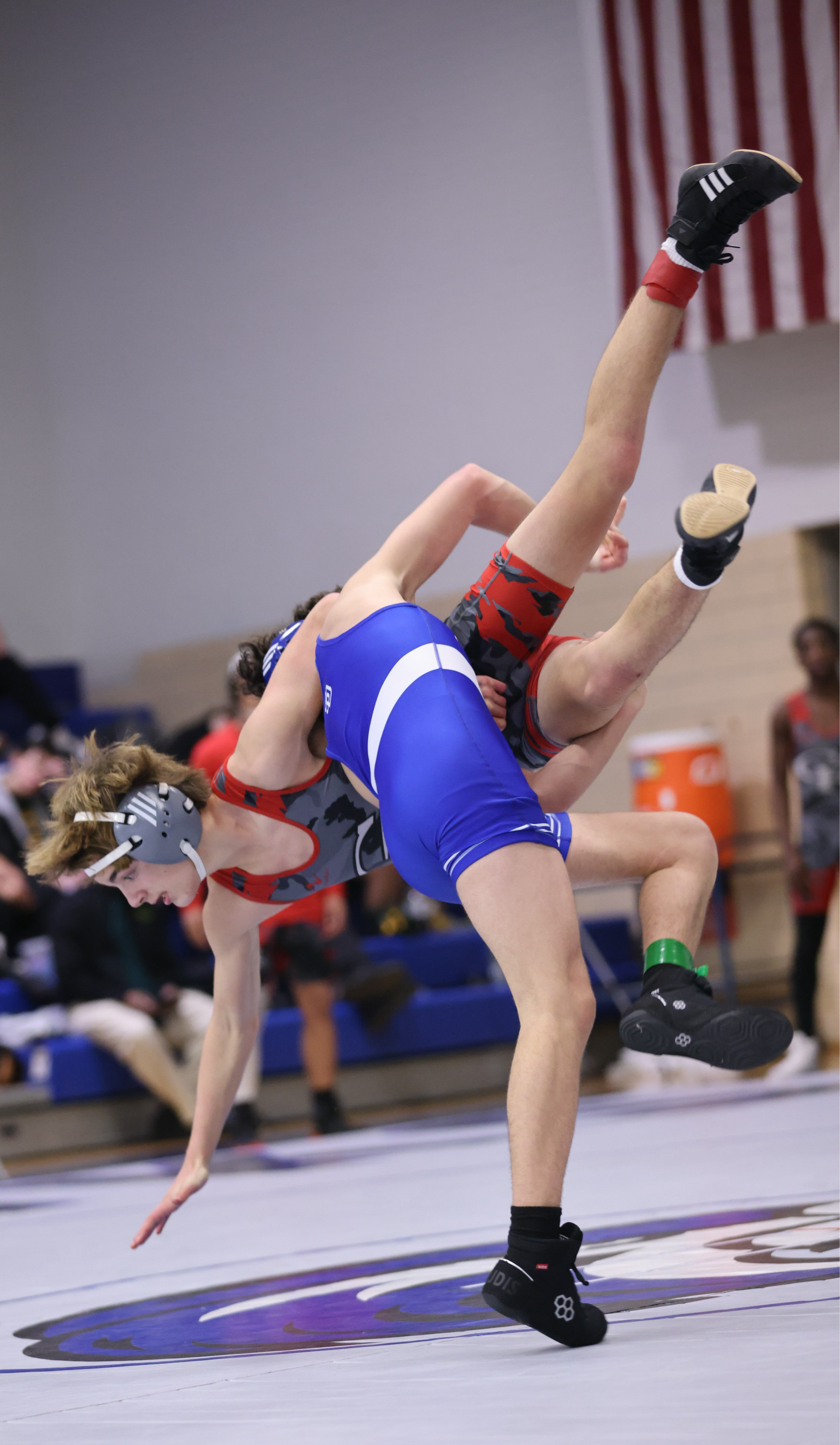 wrestler flipping opponent