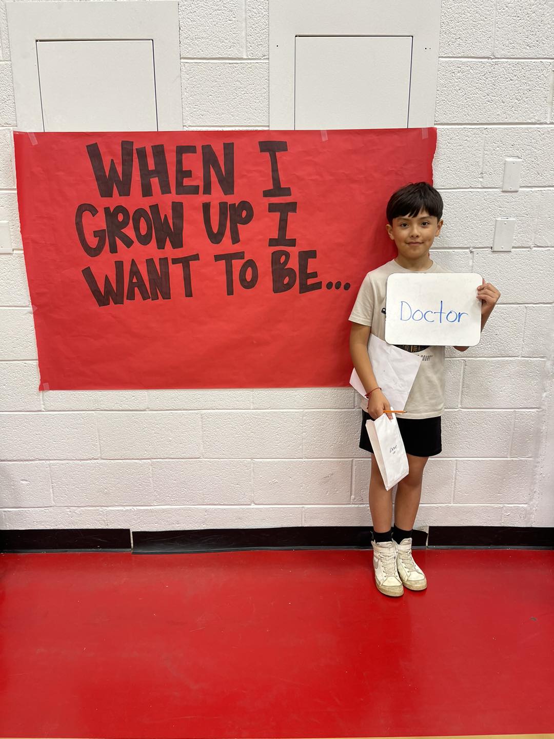 student in front of career day sign