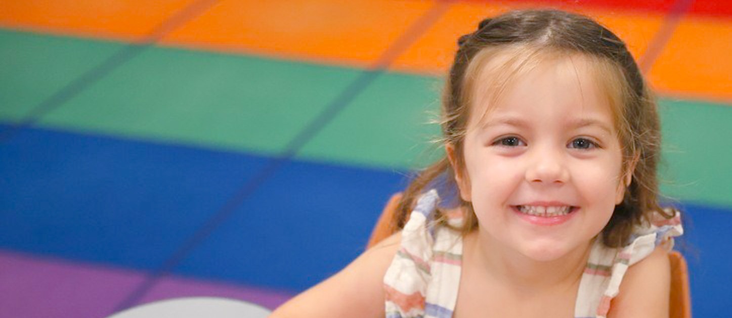 Pre-k student at a desk