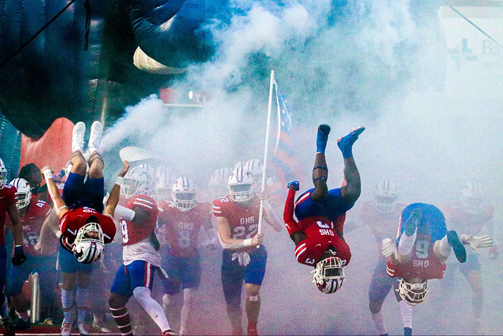 Football players entering stadium
