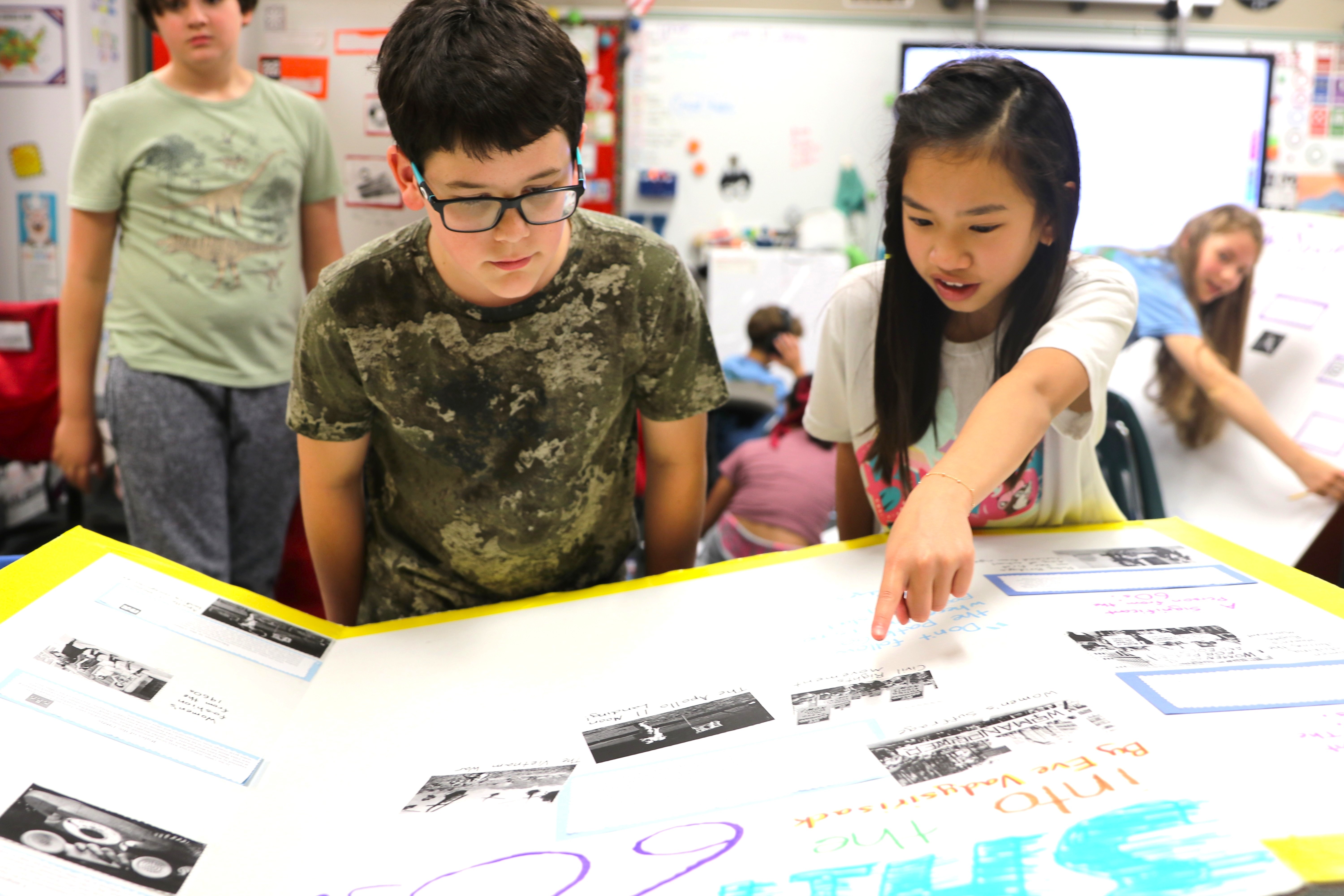 Two students looking at a project