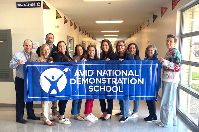 Teachers holding AVID sign
