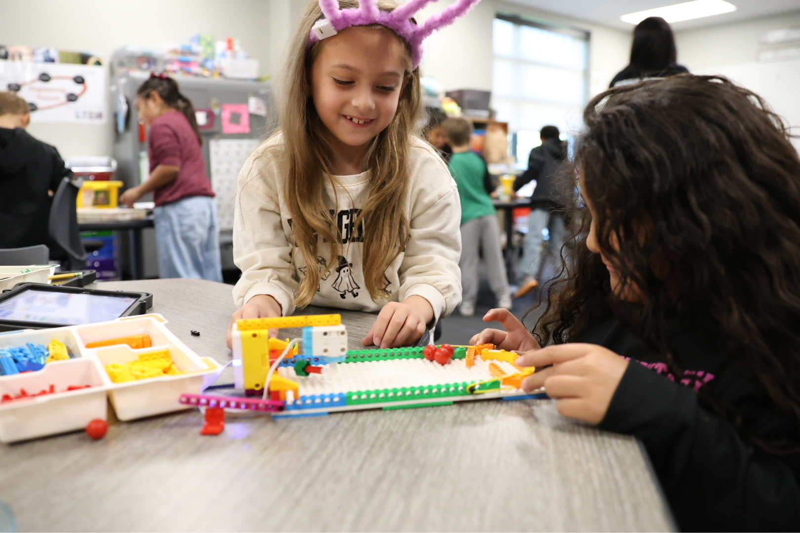 Two students playing with blocks
