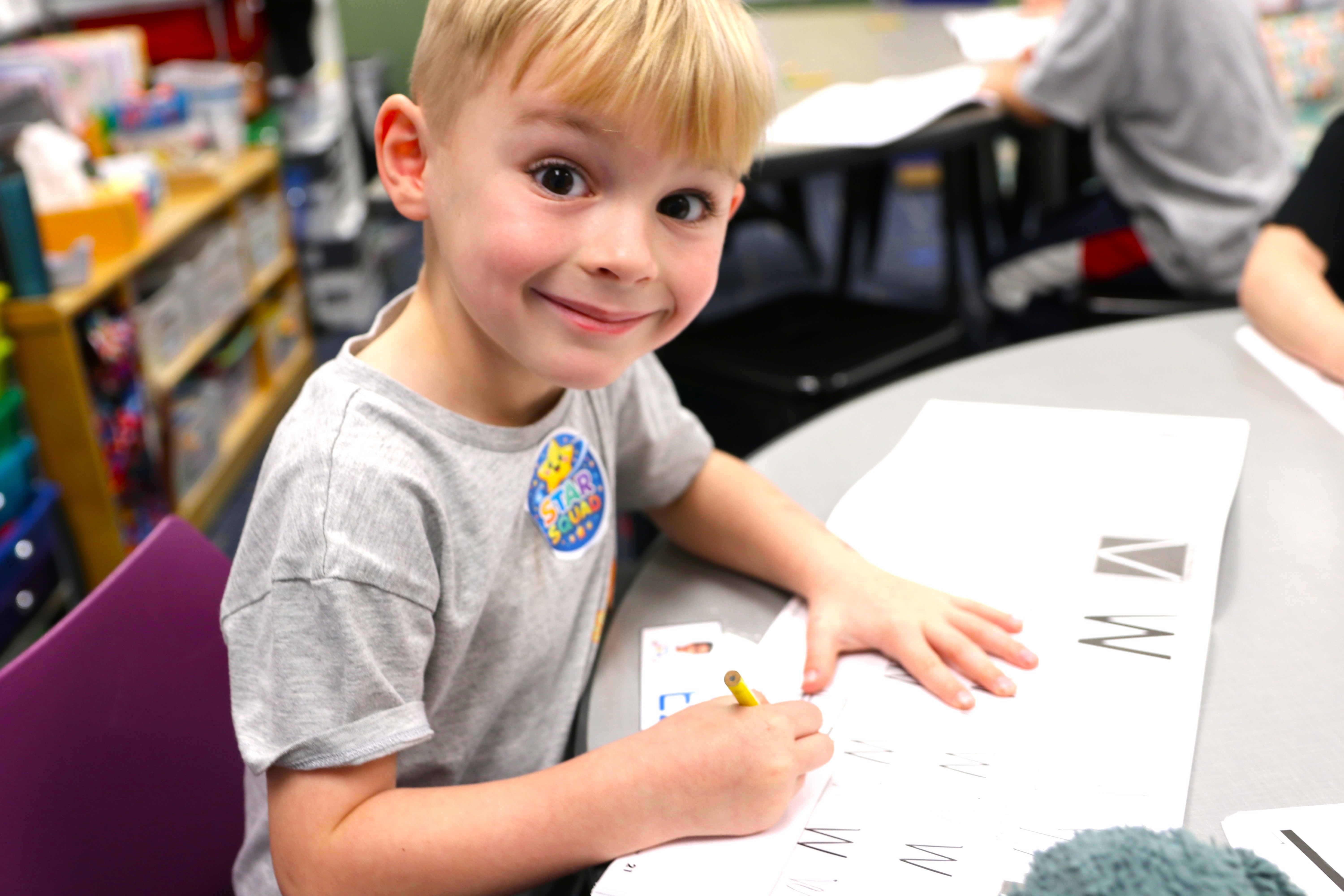 Student working on letters