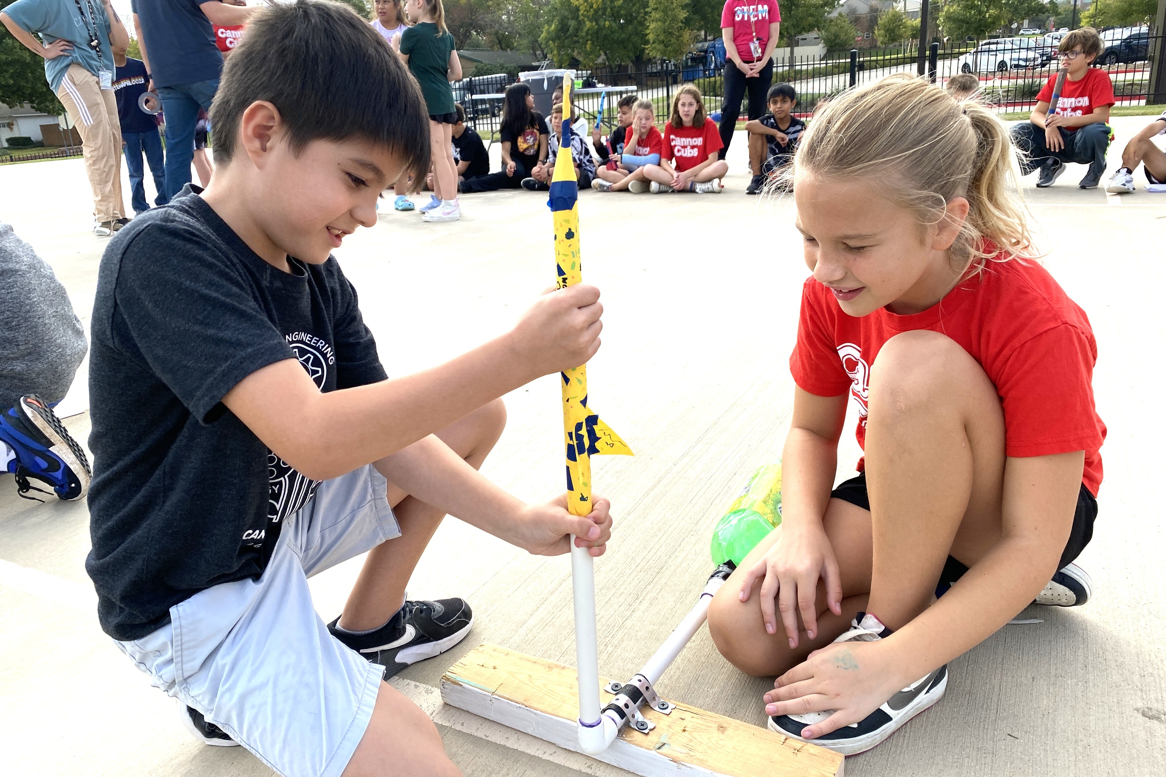 Two students launching rocket