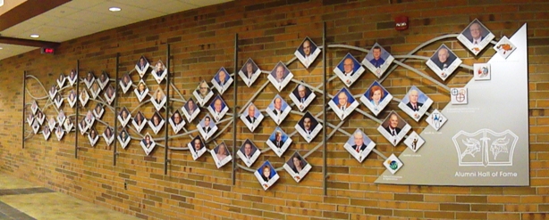hall of fame wall with pictures of alumni