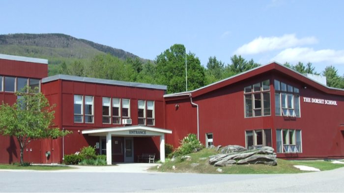 an exterior shot of the Dorset School, which is painted bright red