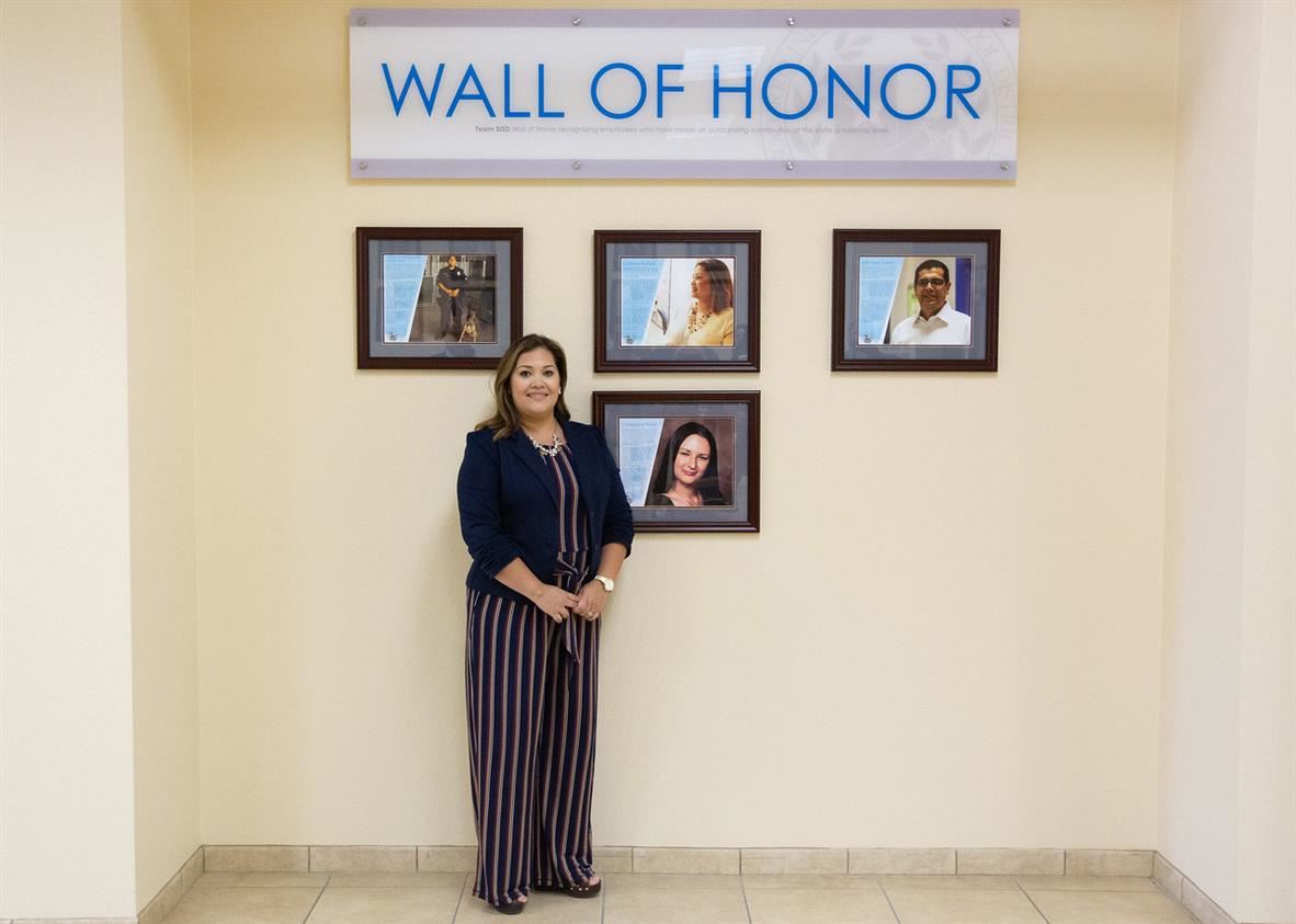 Cristina in front of the Wall of Honor