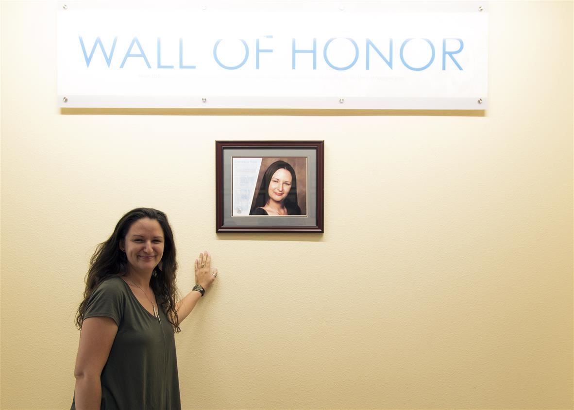 Candace in front of the Wall of Honor