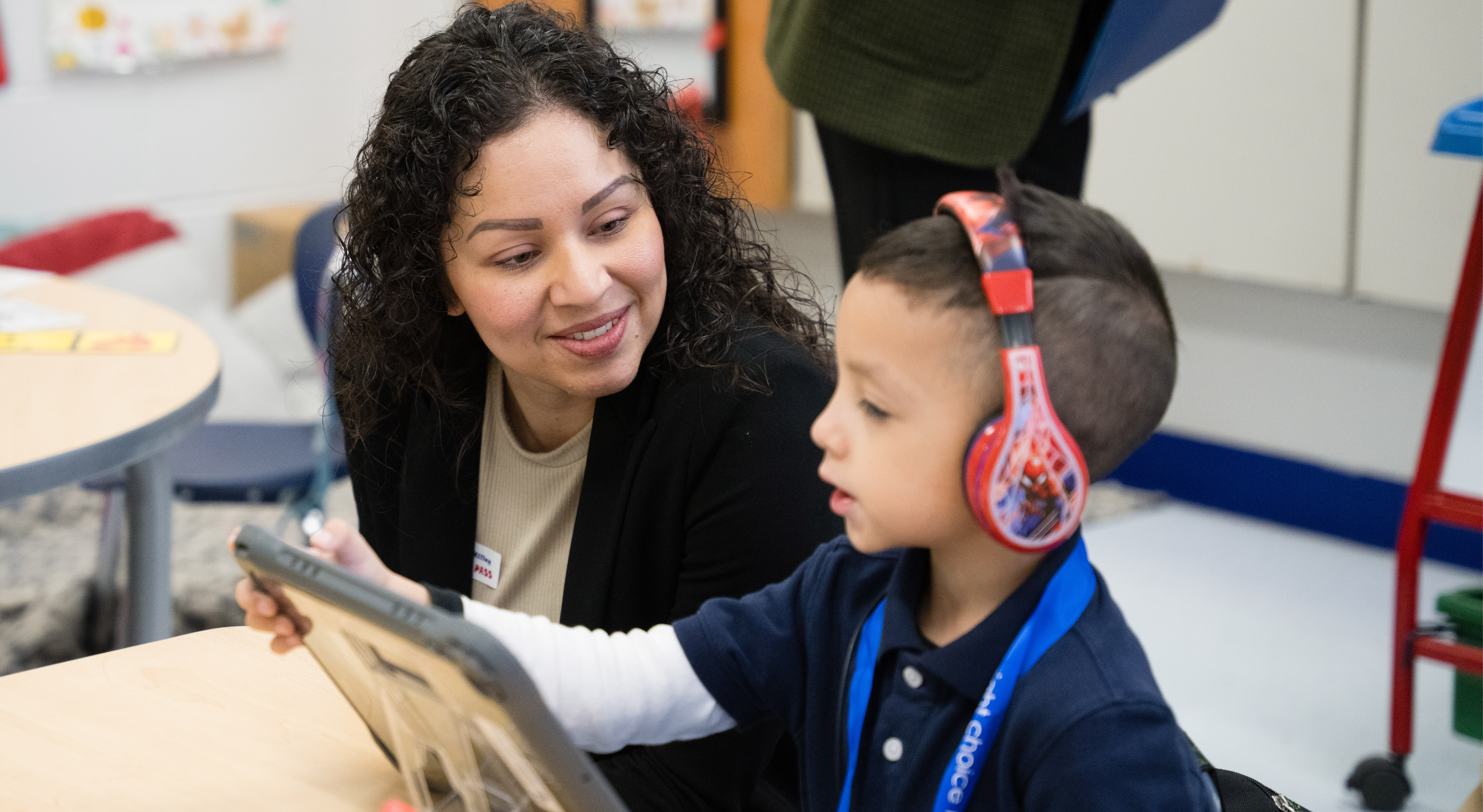 Teacher giving student instruction