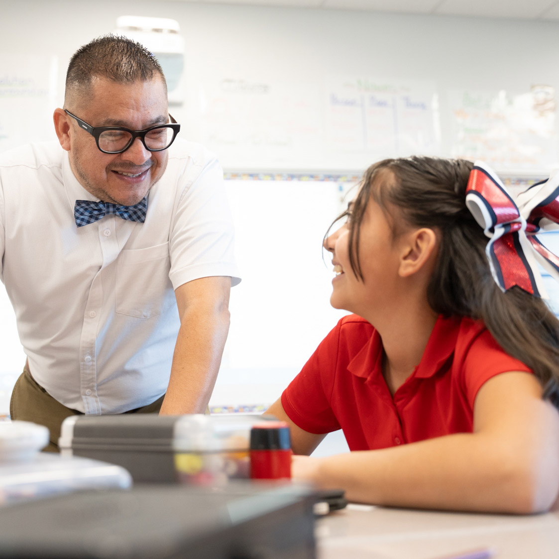 Teacher giving instruction to student