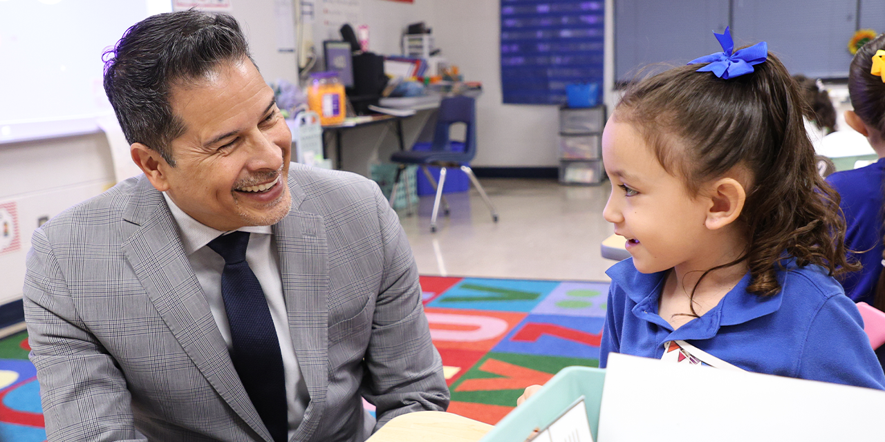 Superintendent smiling at sudent