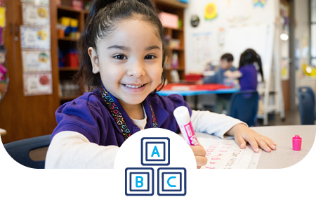 Pre-K student working on an assigment