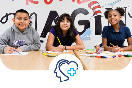 Whole Child Academy students working on a project