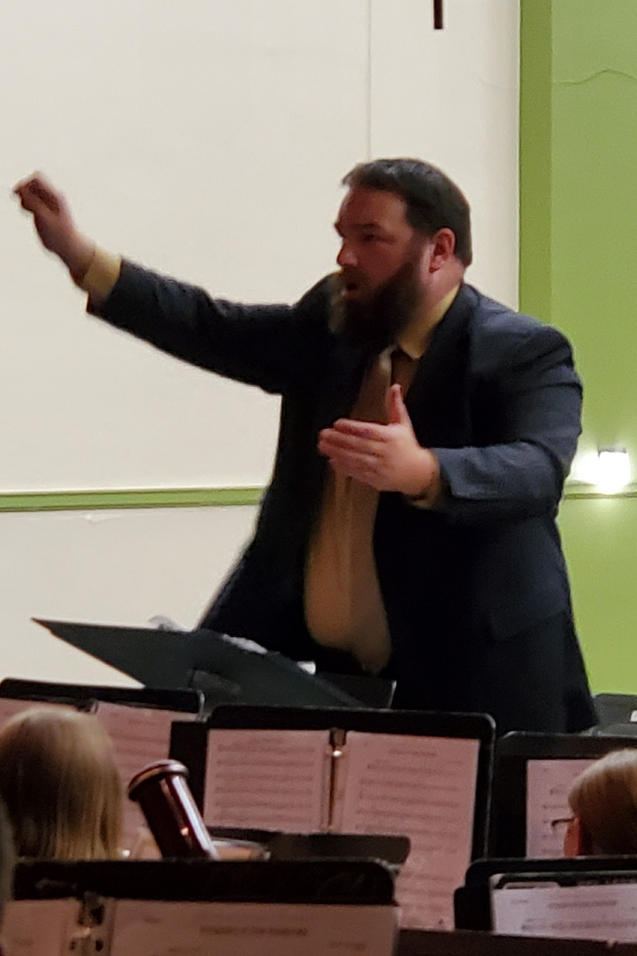 a man conducts a band