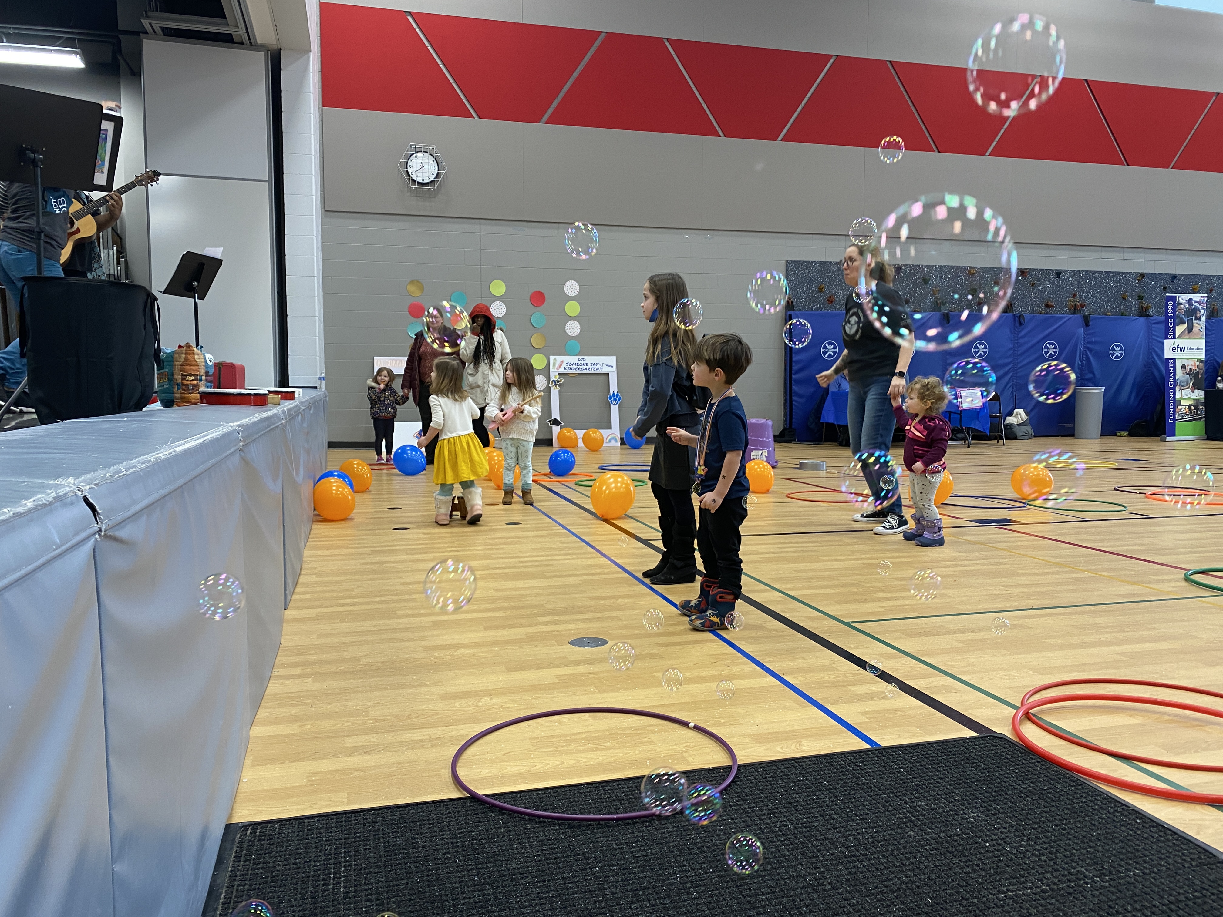 Children in gymnasium with bubbles
