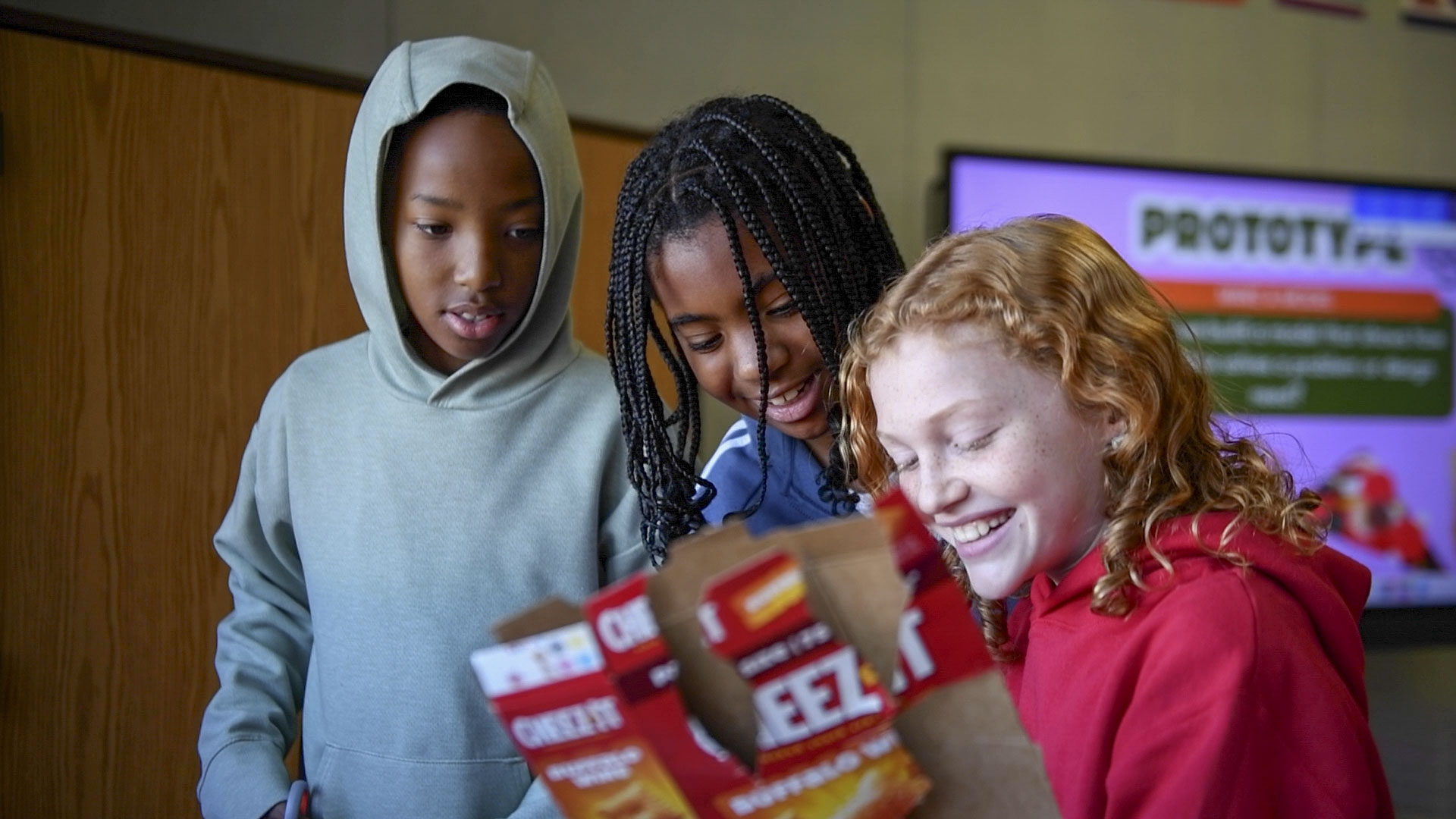 students smiling working together