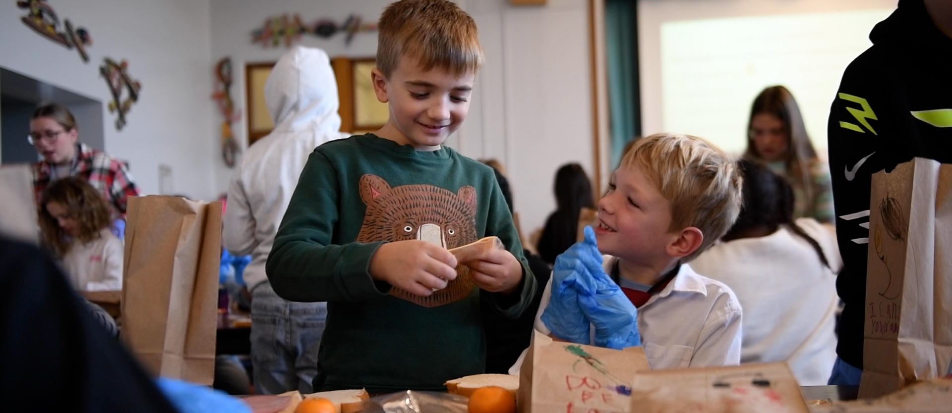 students making a sandwich for a service learning project