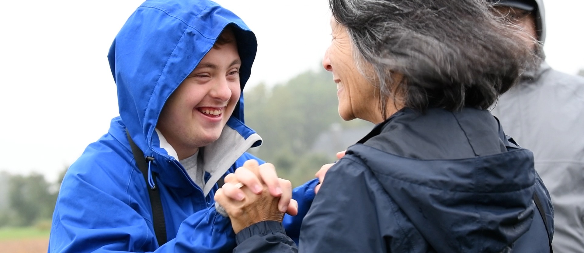 student high-fiving a teacher and smiling
