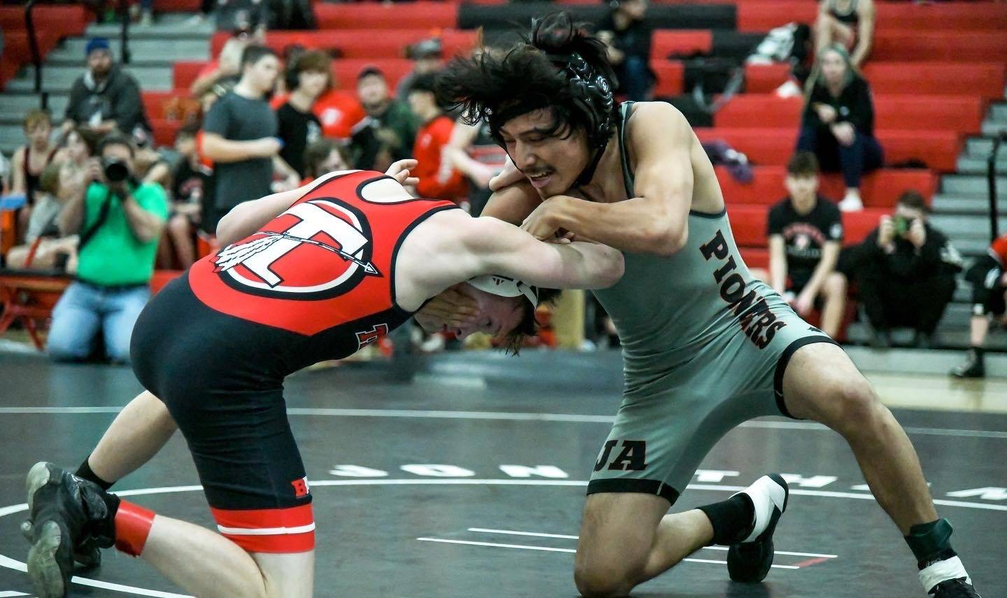 two wrestlers spar