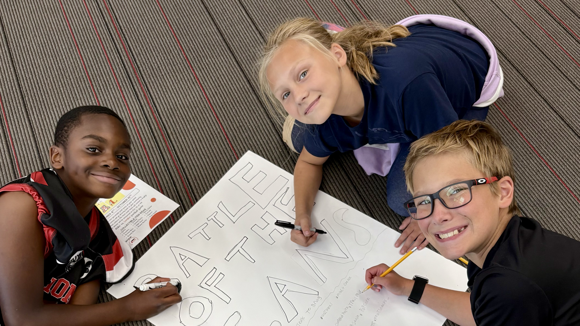 students working on poster