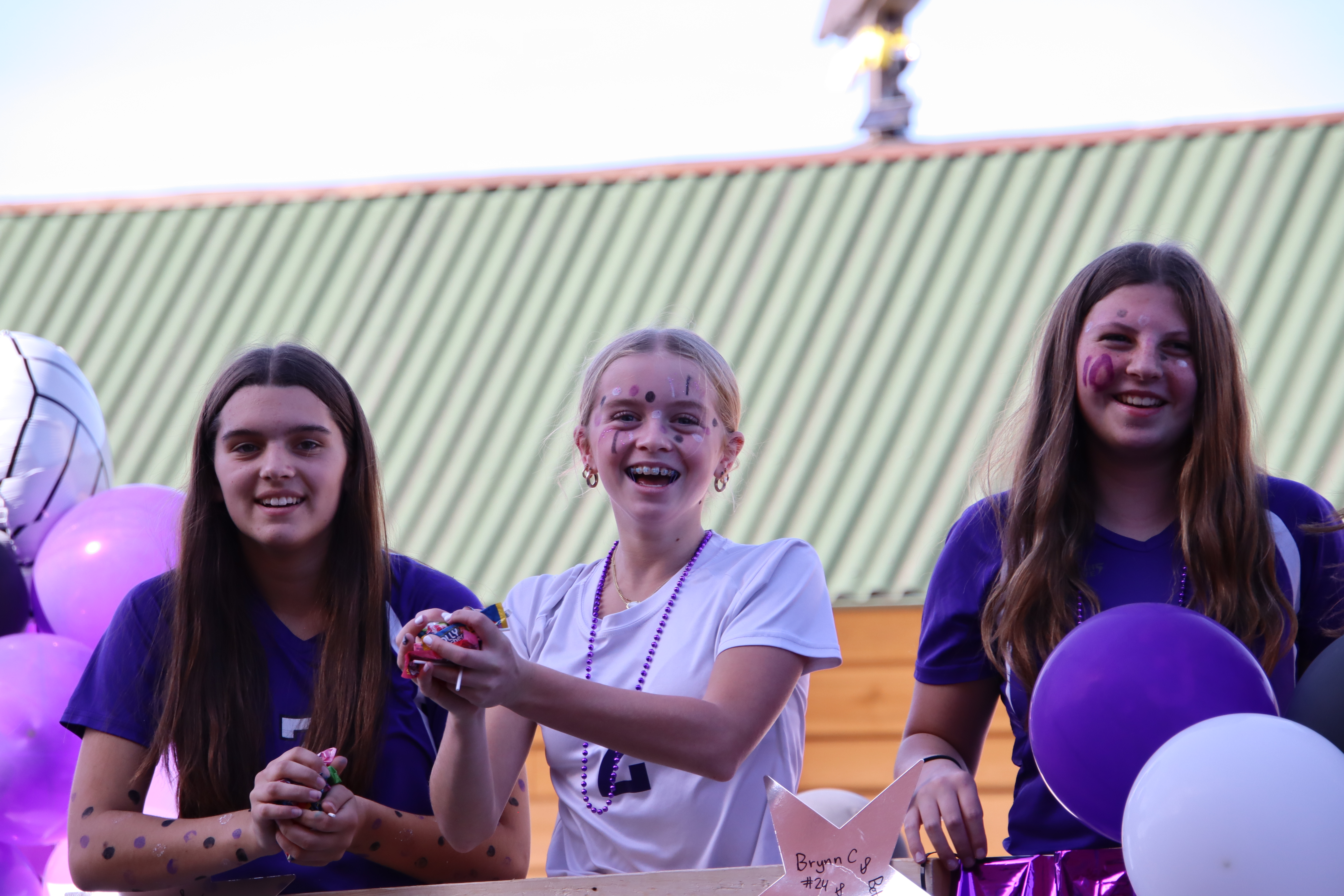 Students on a parade float in Grantsburg colors. 