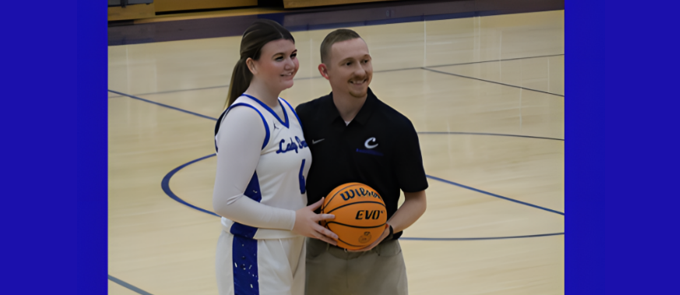 CHS Basketball Student holding the ball