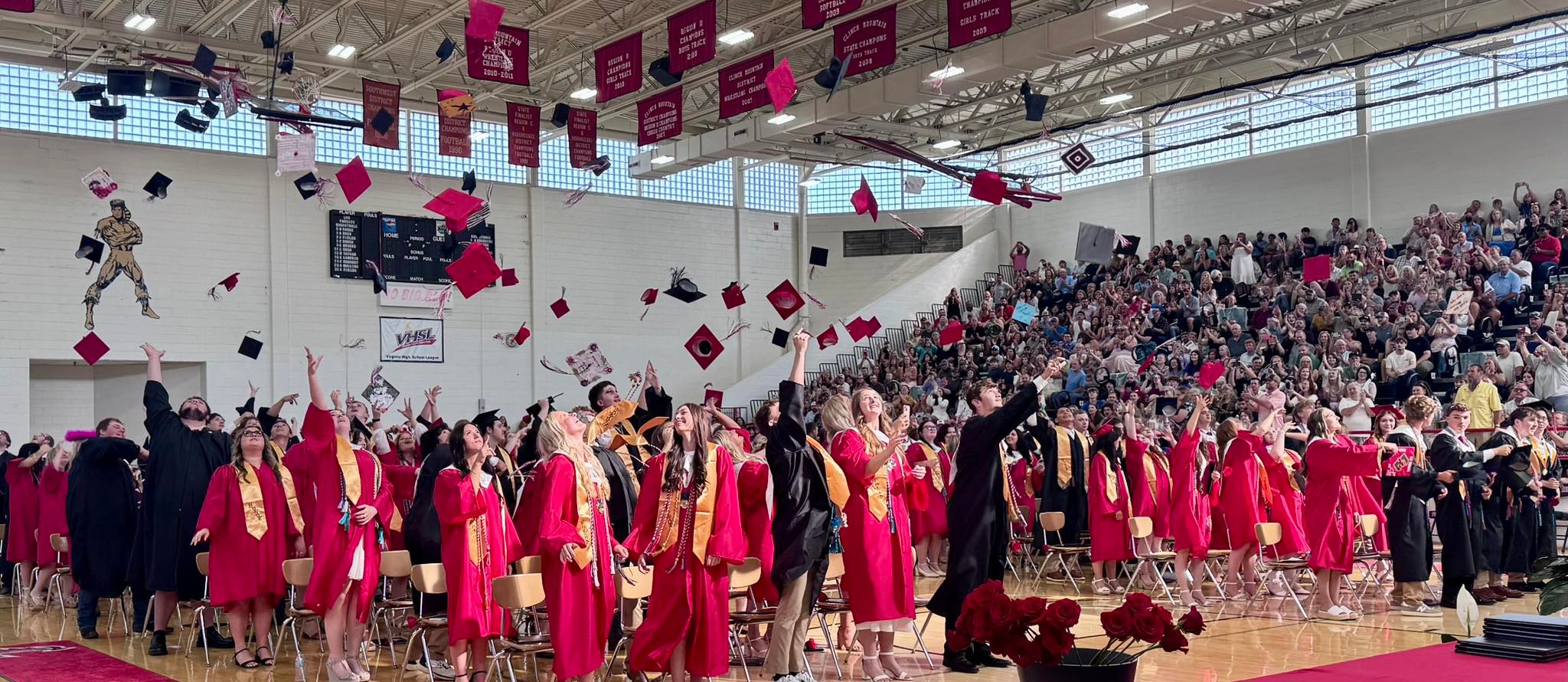 LHS Graduation - students throwing caps in the air