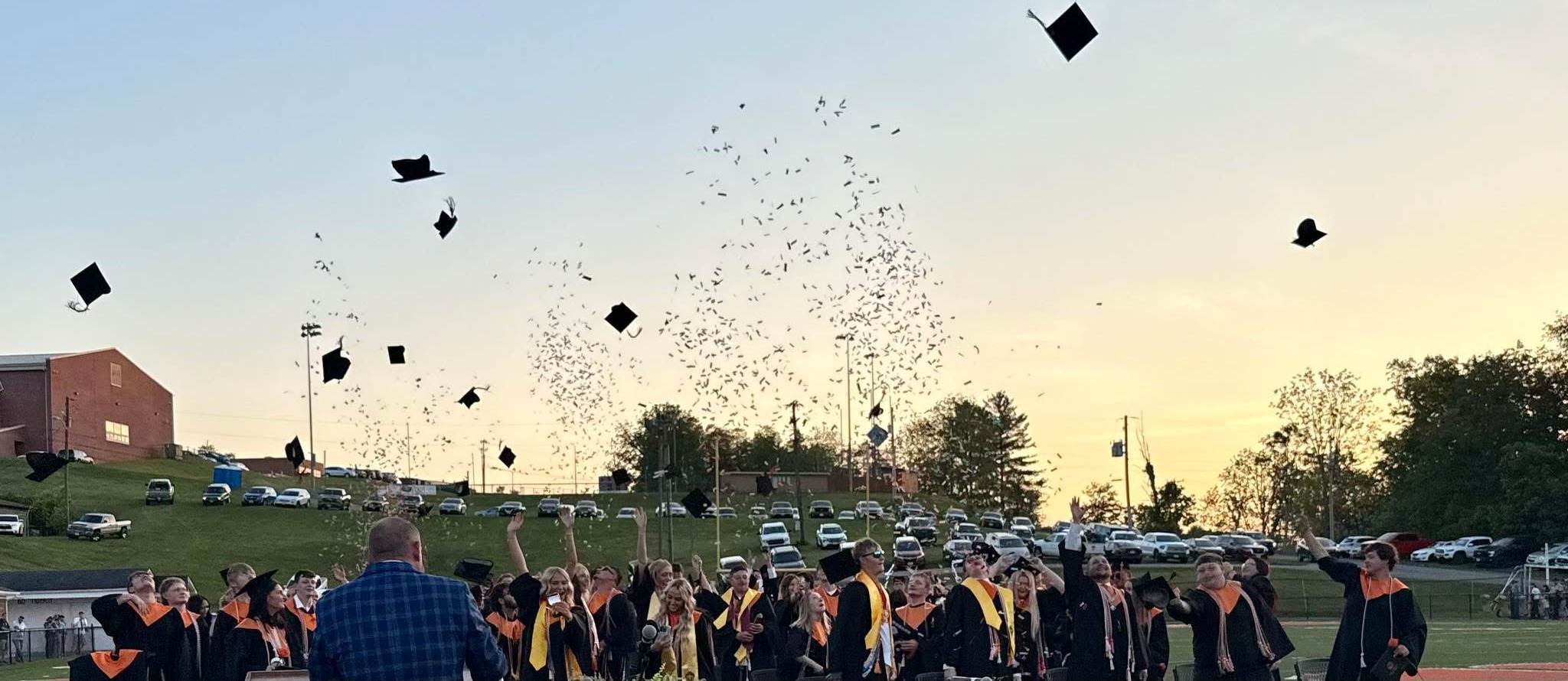 Honaker High Graduation - students throwing cap in the air