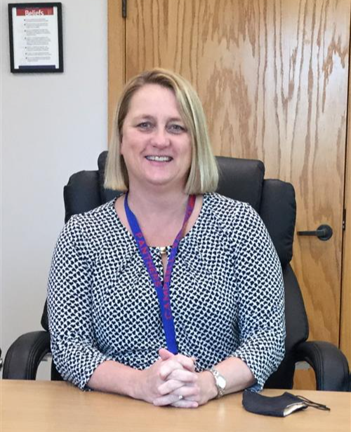 superintendent sitting at her desk