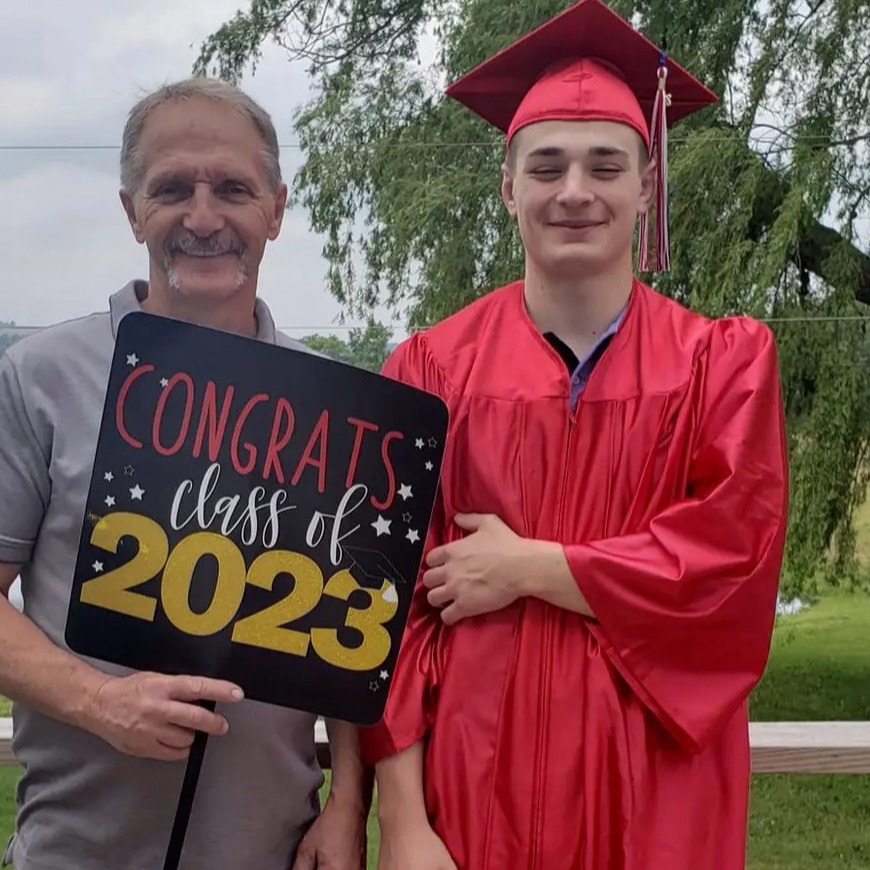 student graduating with dad
