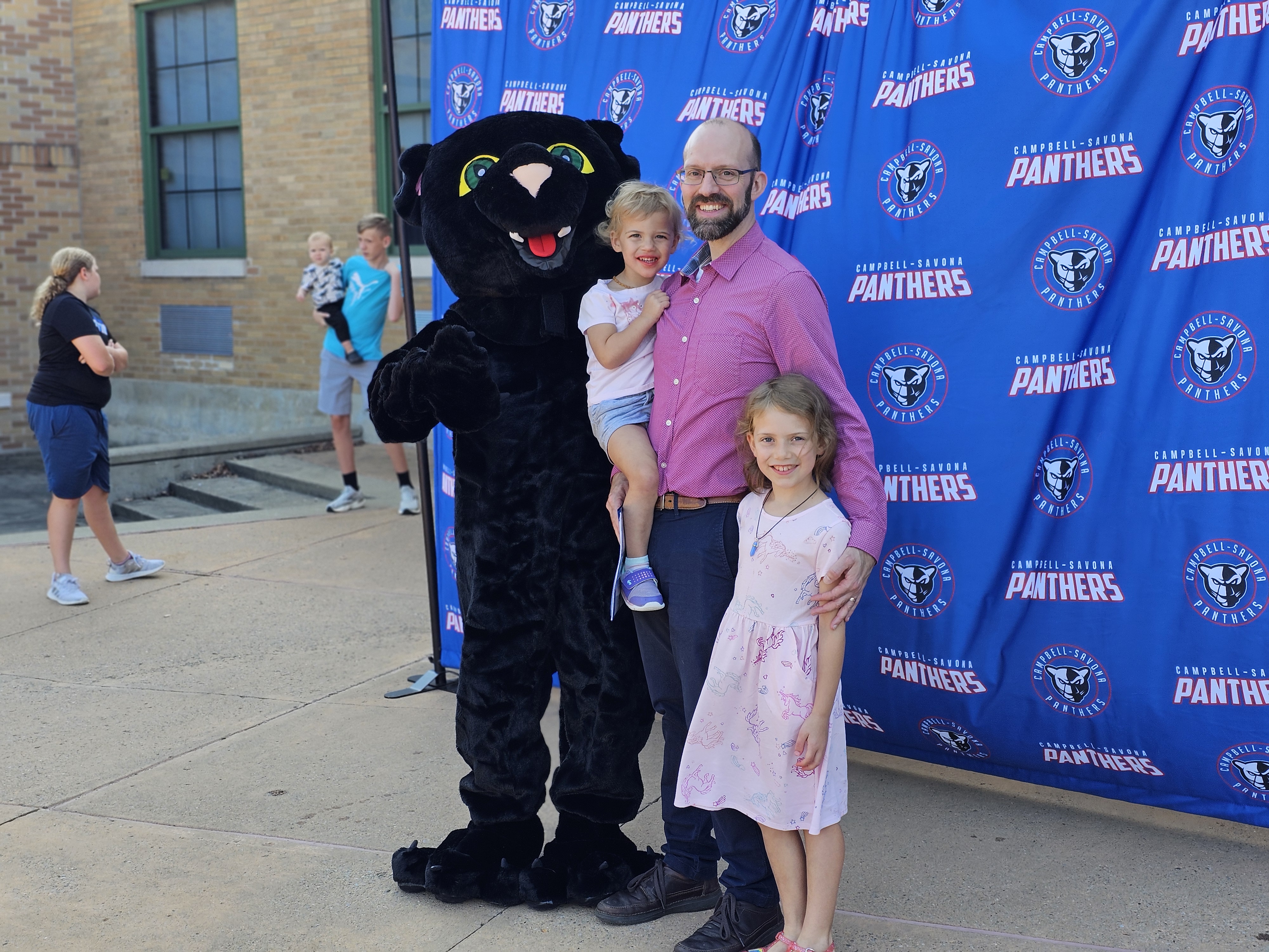 Dad and two daughters with CS Panther Mascot