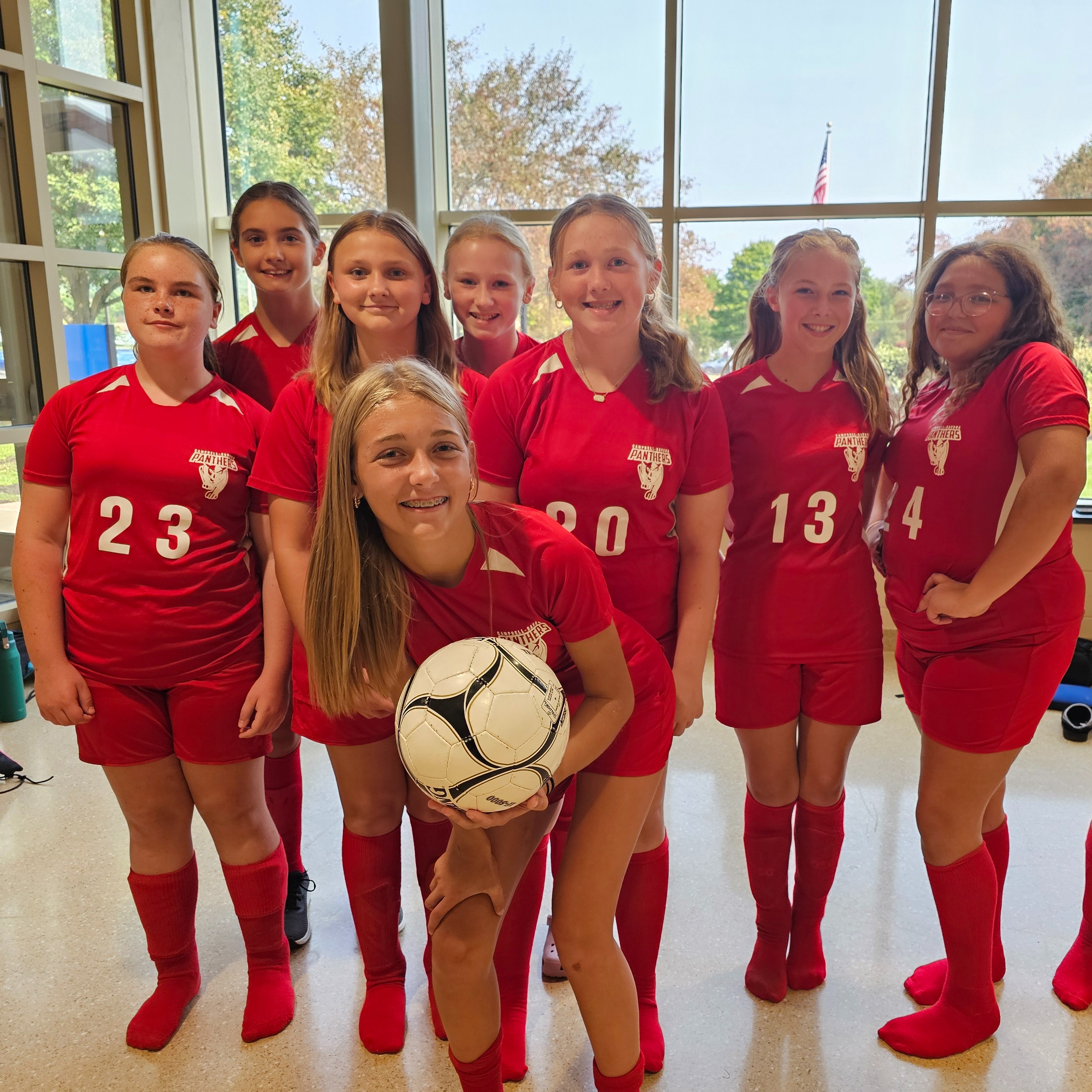 Sports team group photo in red uniforms