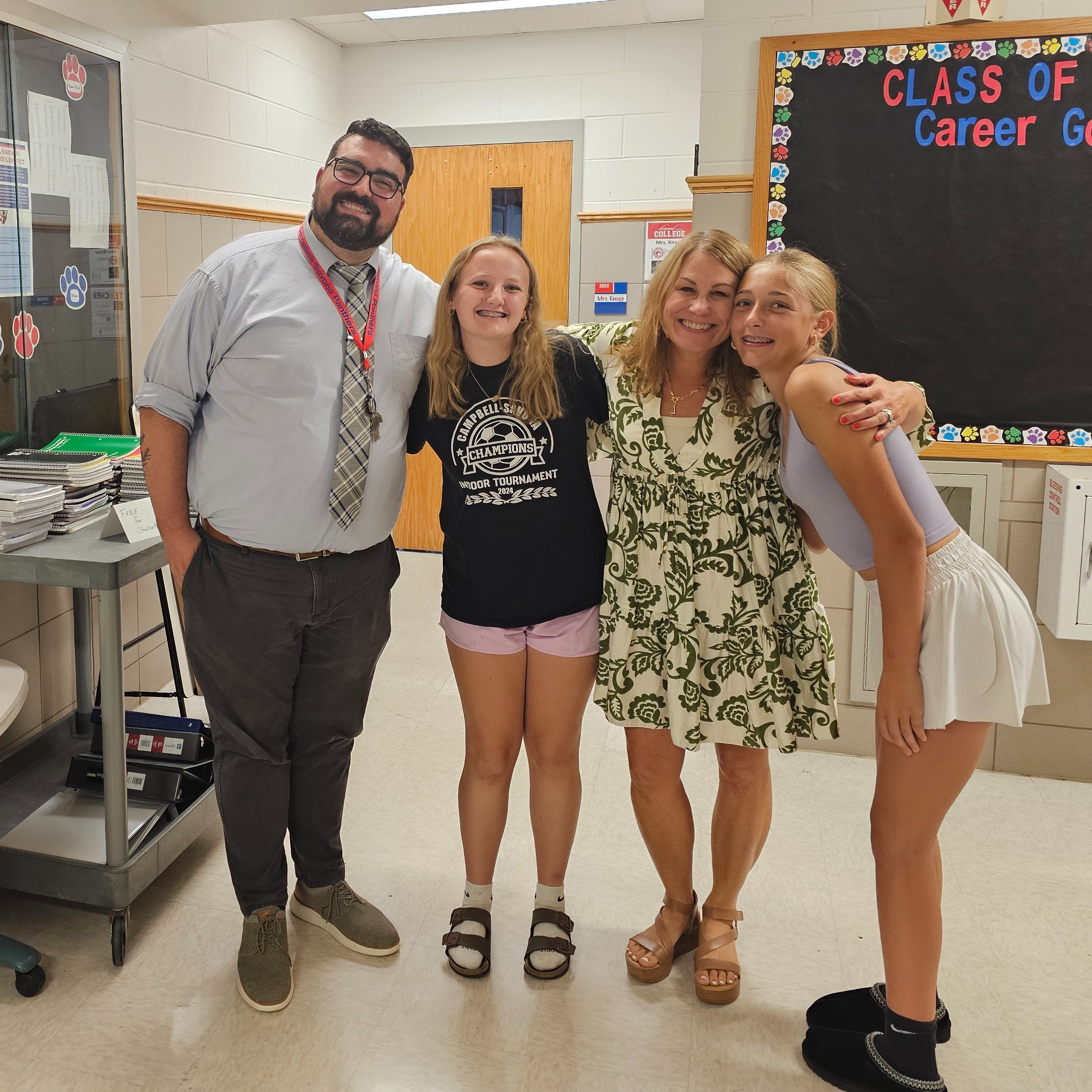 2 students posing with school counselors