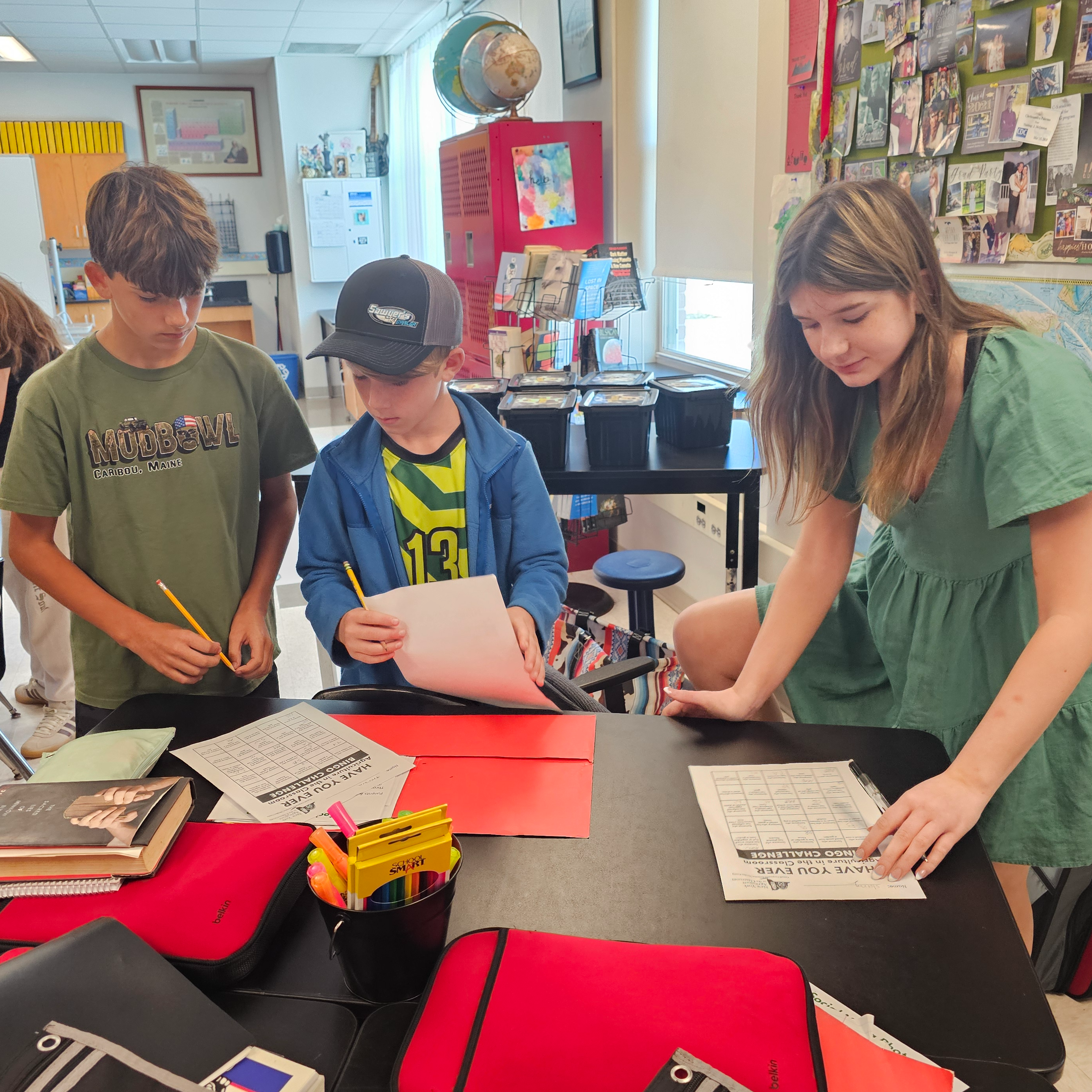 Students working together gathered around a table